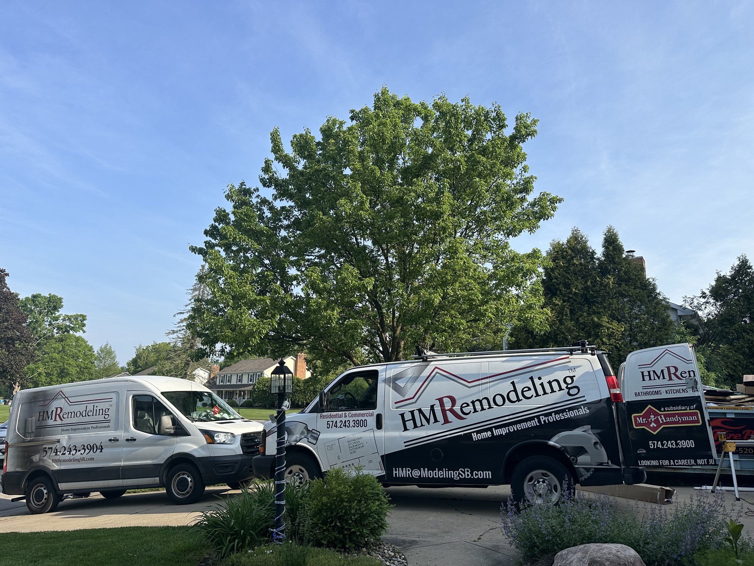 HM Remodeling van parked in front of a commercial job in South Bend Indiana