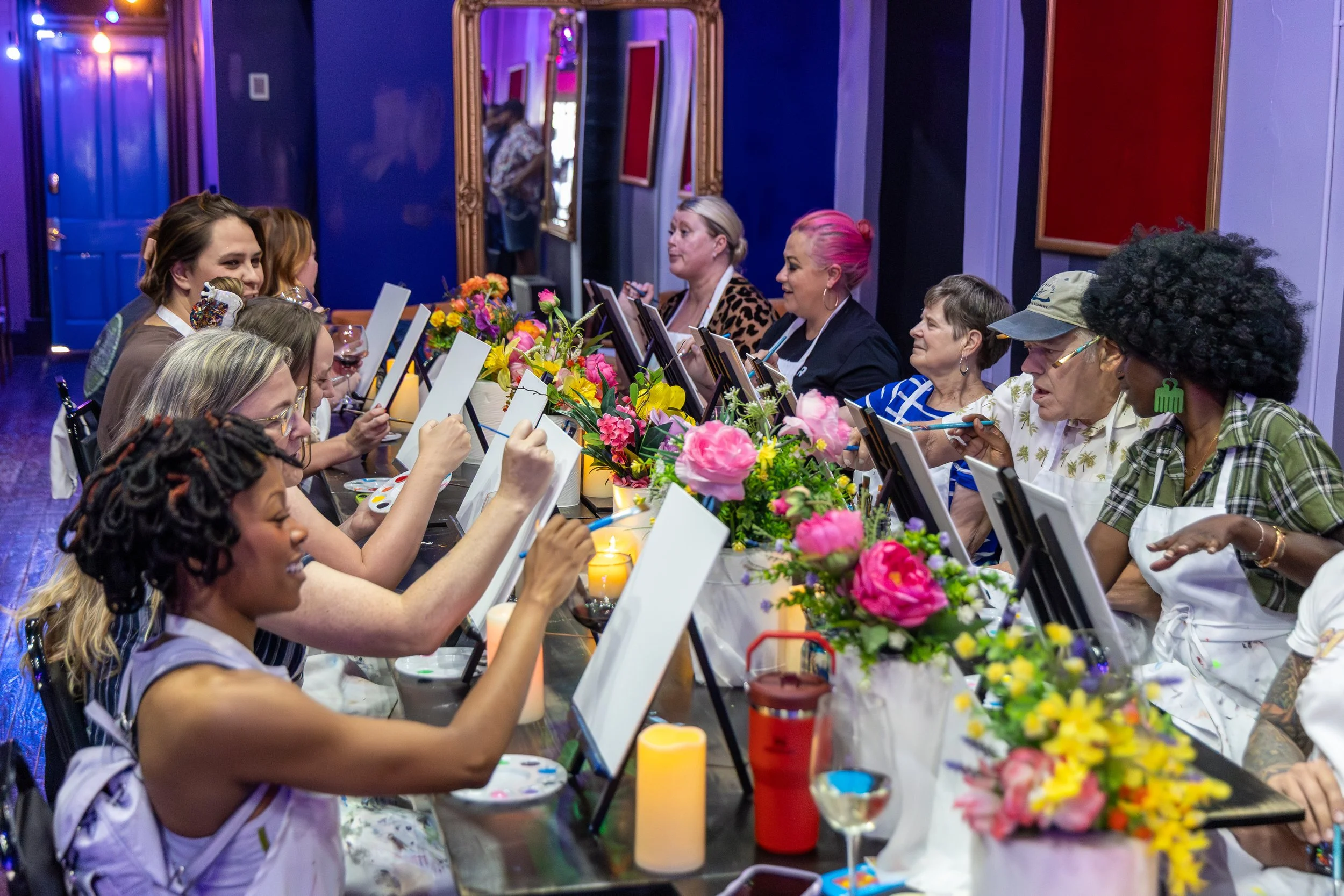 Guests enjoying a guided painting class at RUCKUS in East Walnut Hills, Cincinnati. Book creative workshops, paint parties, date nights, birthdays, team-building events, and private experiences in an inclusive, pet-friendly space.