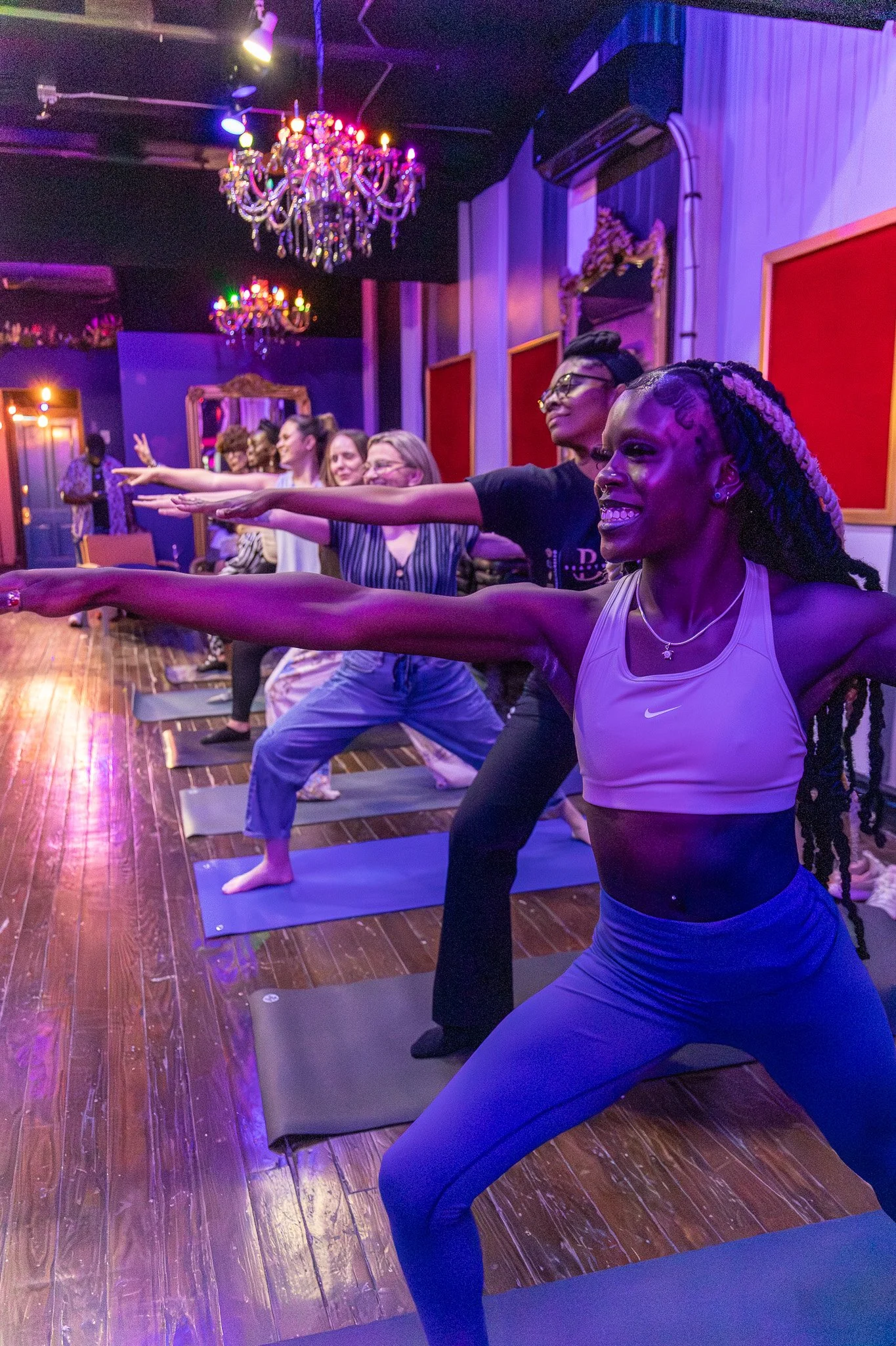 Community yoga class at RUCKUS in Cincinnati, an inclusive creative space welcoming all ages, all experience levels, LGBTQ+ community members, and anyone looking to connect through movement and wellness.