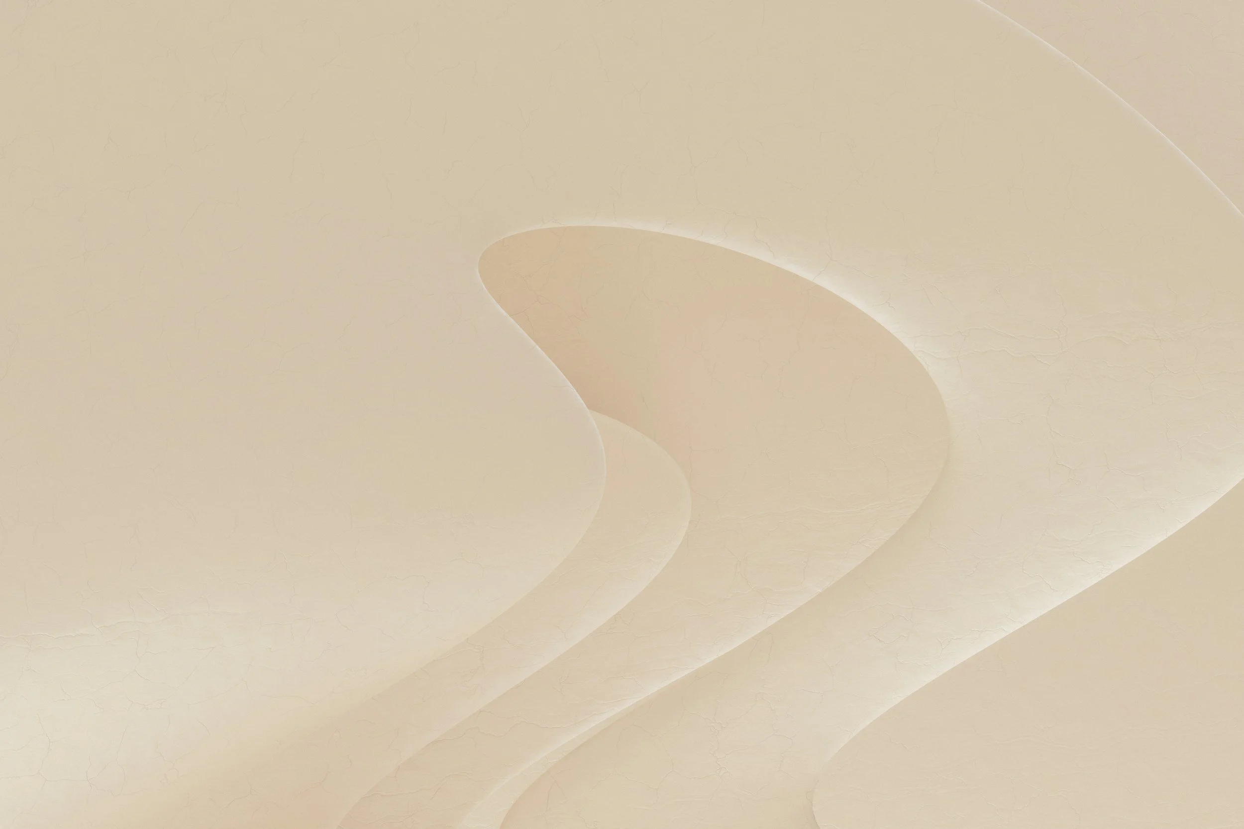 Close-up of a textured beige wall with a shadow cast by a small light source.