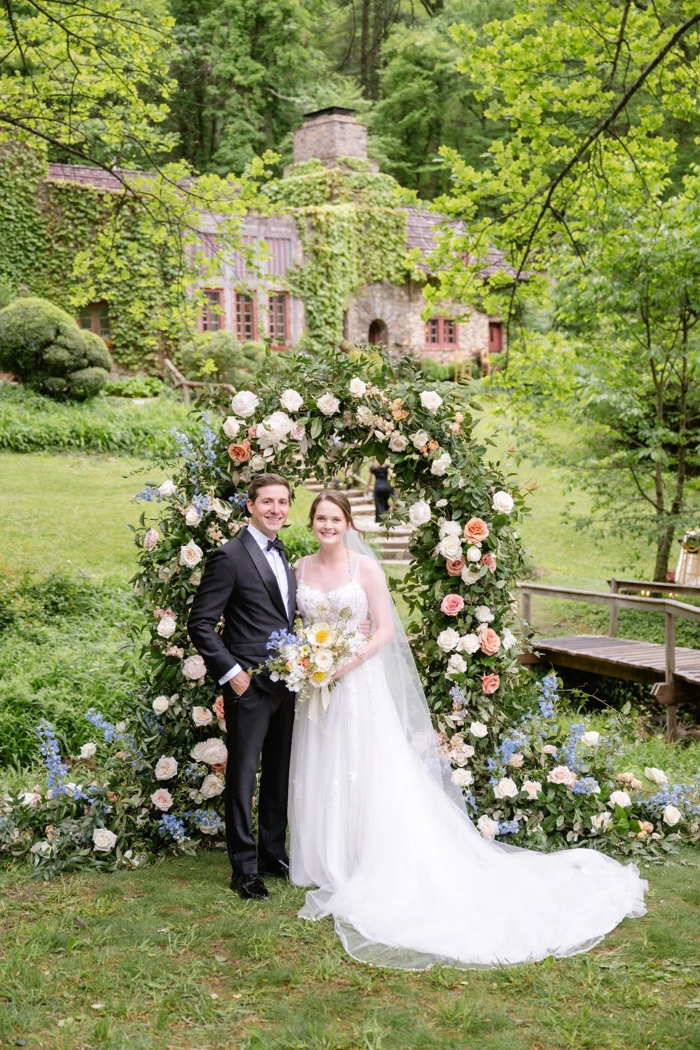 Pastel flowers on wedding ceremony arch