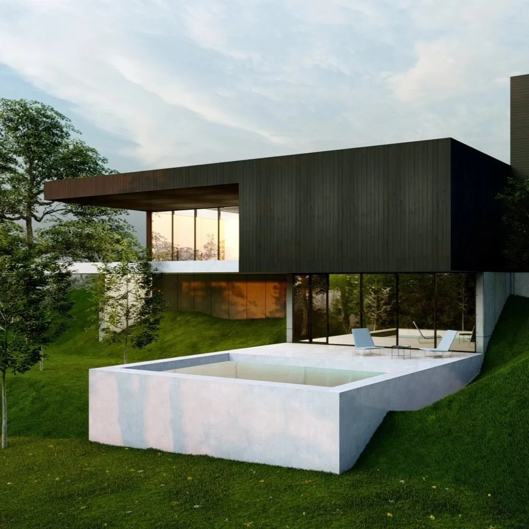 Modern house with dark upper section, large windows, outdoor seating area, and pool surrounded by green grass and trees during sunset.