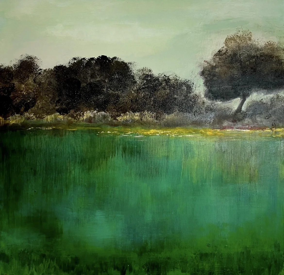 Painting of a landscape with a green body of water in the foreground, dark trees along the shoreline, and a light green sky.