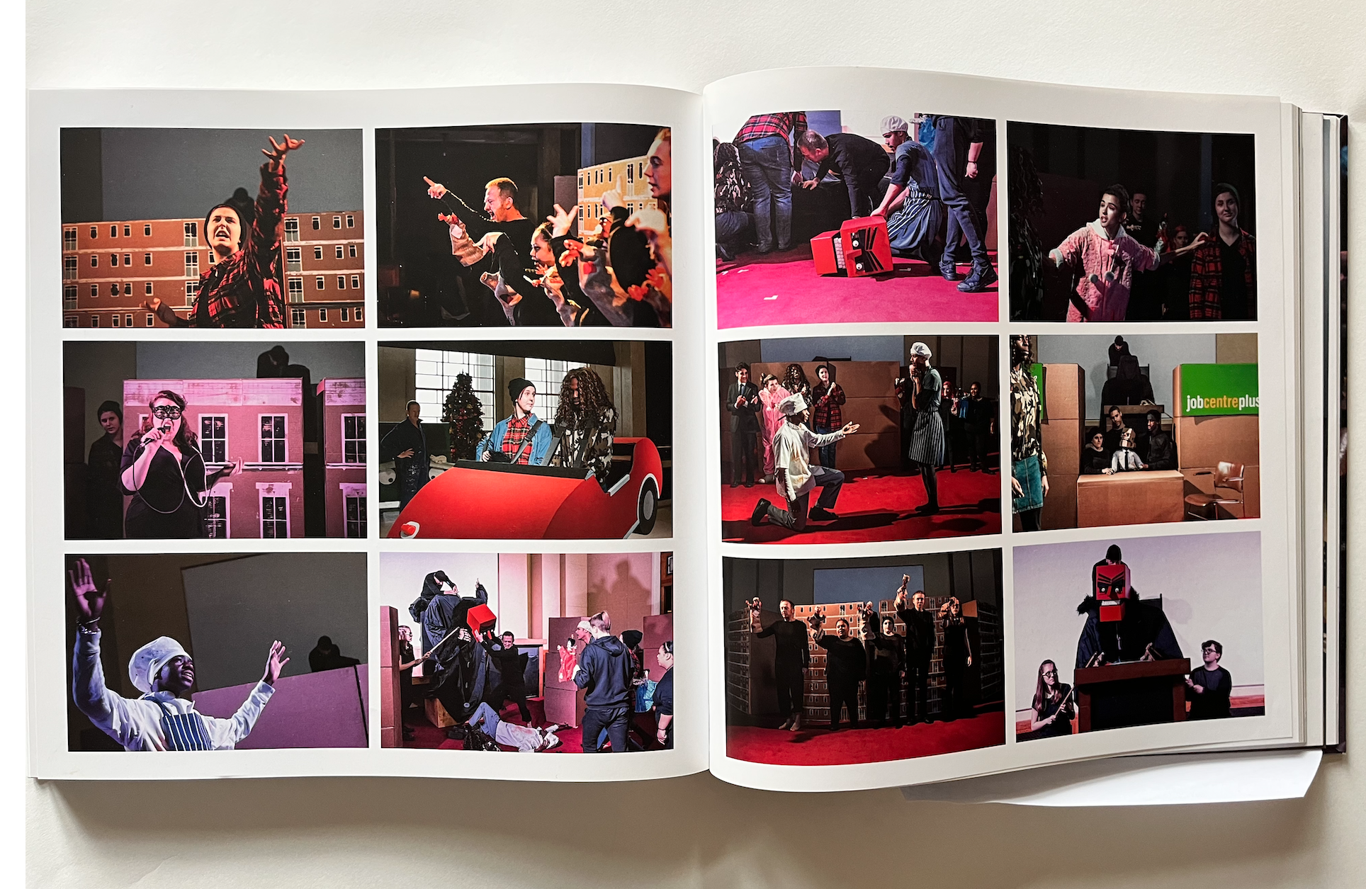 Two full pages showing 12 colour photos of the performance by Cah McCail and young people from Barking and Dagenham College Jack and the Beanstalk. Props include giant puppets and a Job Centre Plus sign.