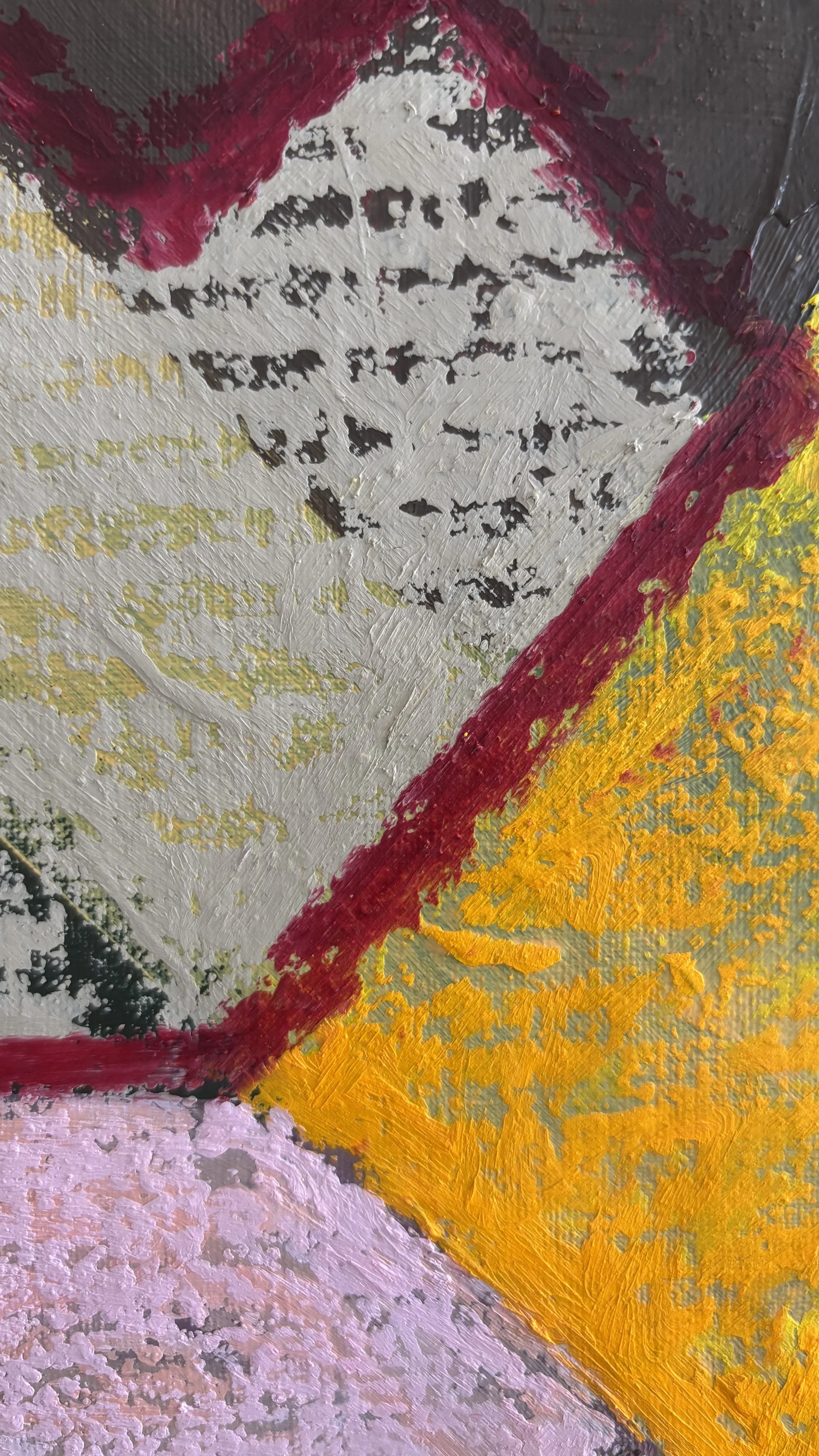 Close-up of a grey-green angular shape outlined in burgundy beside golden yellow, with scattered charcoal marks, visible canvas weave and uneven layers of paint.