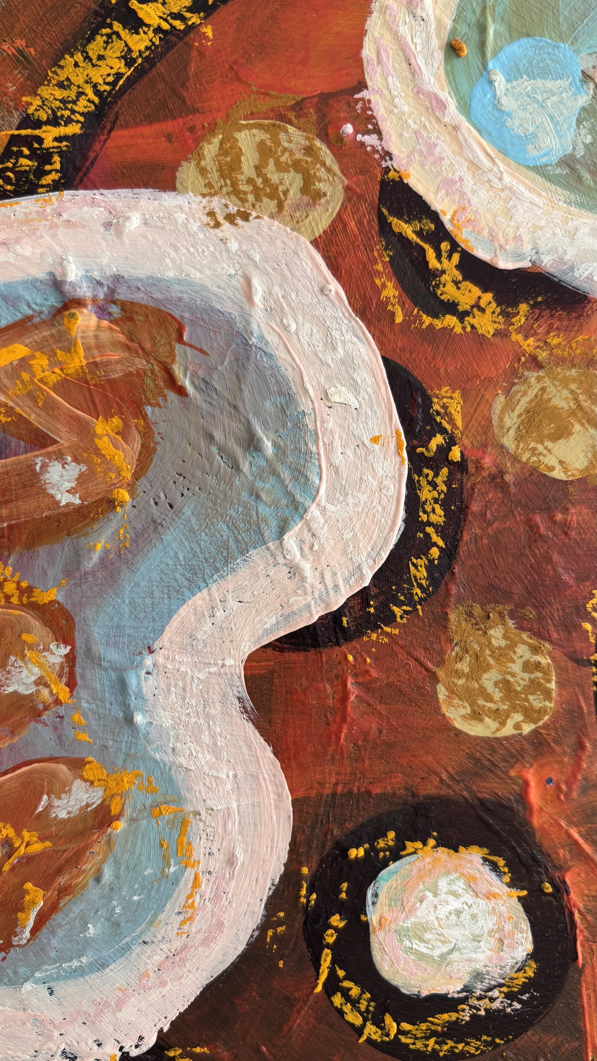 Close-up of a pale blue serpentine shape edged in blush pink, beside black curves dotted with yellow, translucent ochre circles and layered rust-red paint.