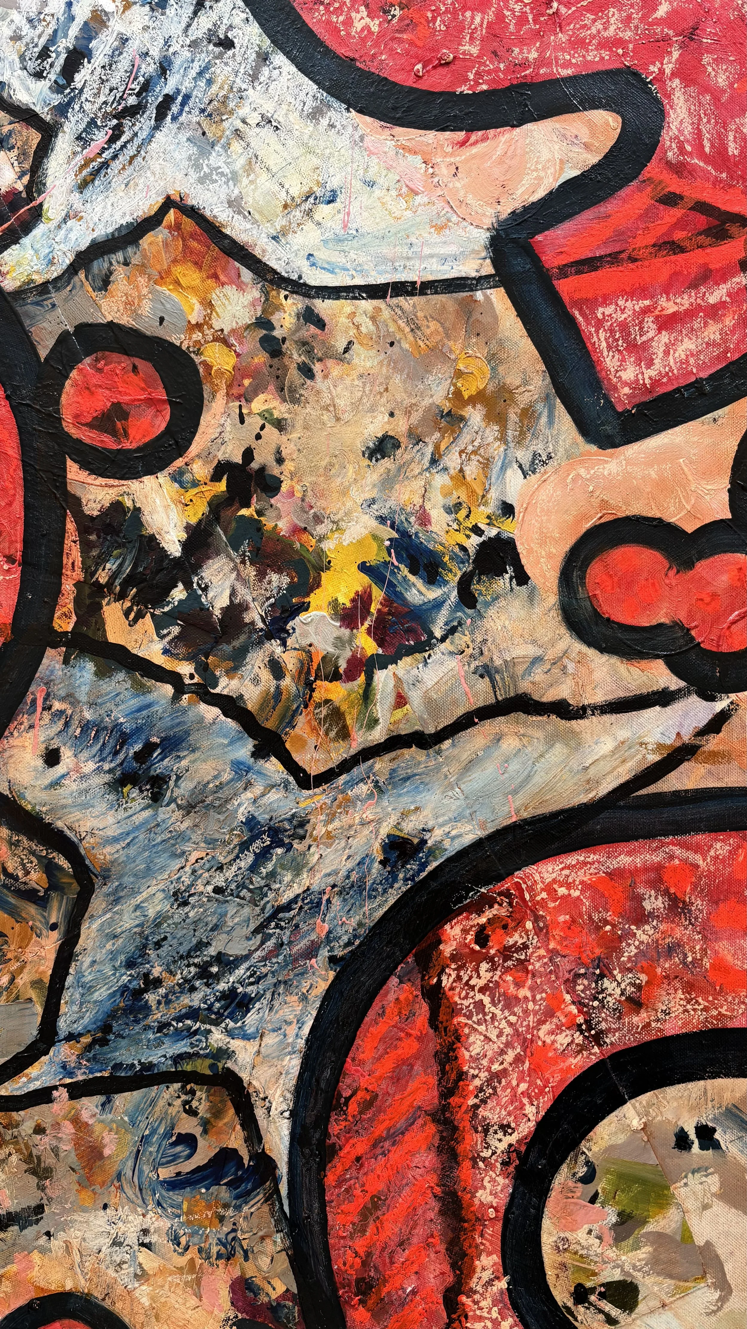 Close-up of layered paint texture, with a jagged blue-grey shape edged in black beneath red circular motifs, scattered yellow marks and mottled peach and charcoal.