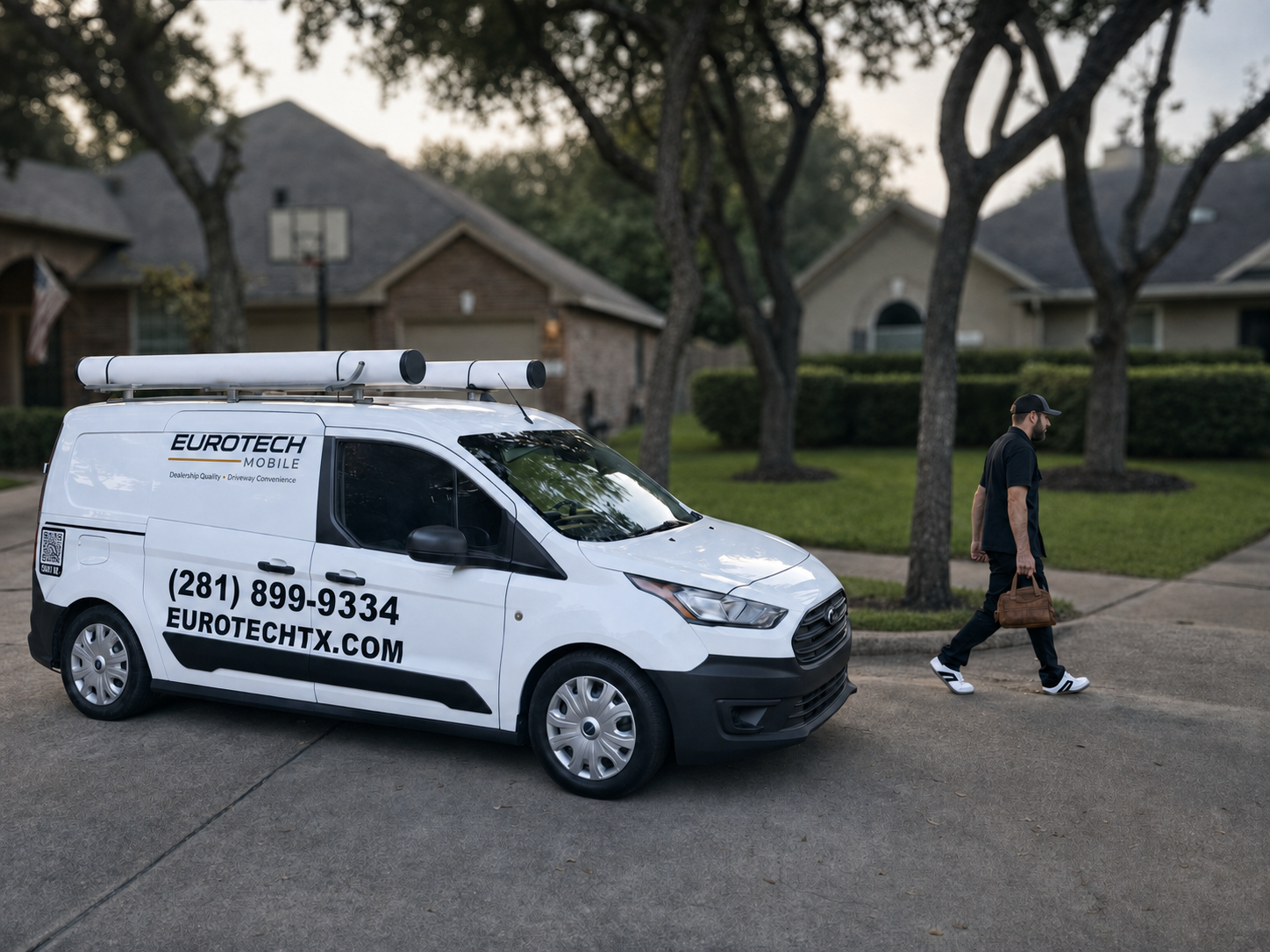 EuroTech Mobile technician carrying a tool bag from the service van for a driveway appointment near Sugar Land, Texas.