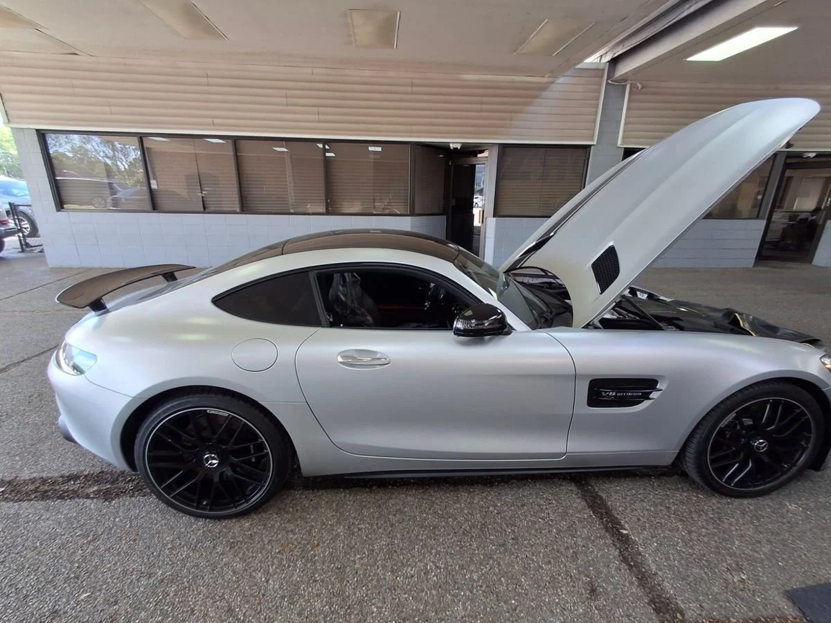 Mercedes-Benz AMG GT with the hood open during a mobile pre-purchase inspection.