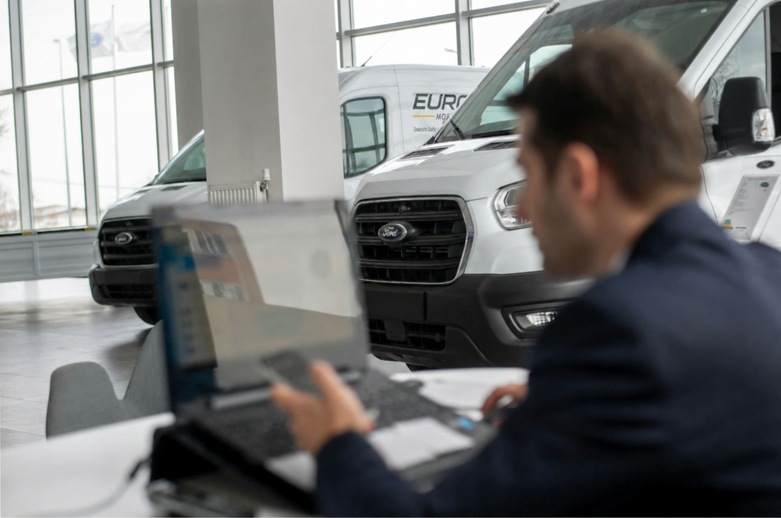 EuroTech Mobile service appointment being reviewed with a branded service van in the background.