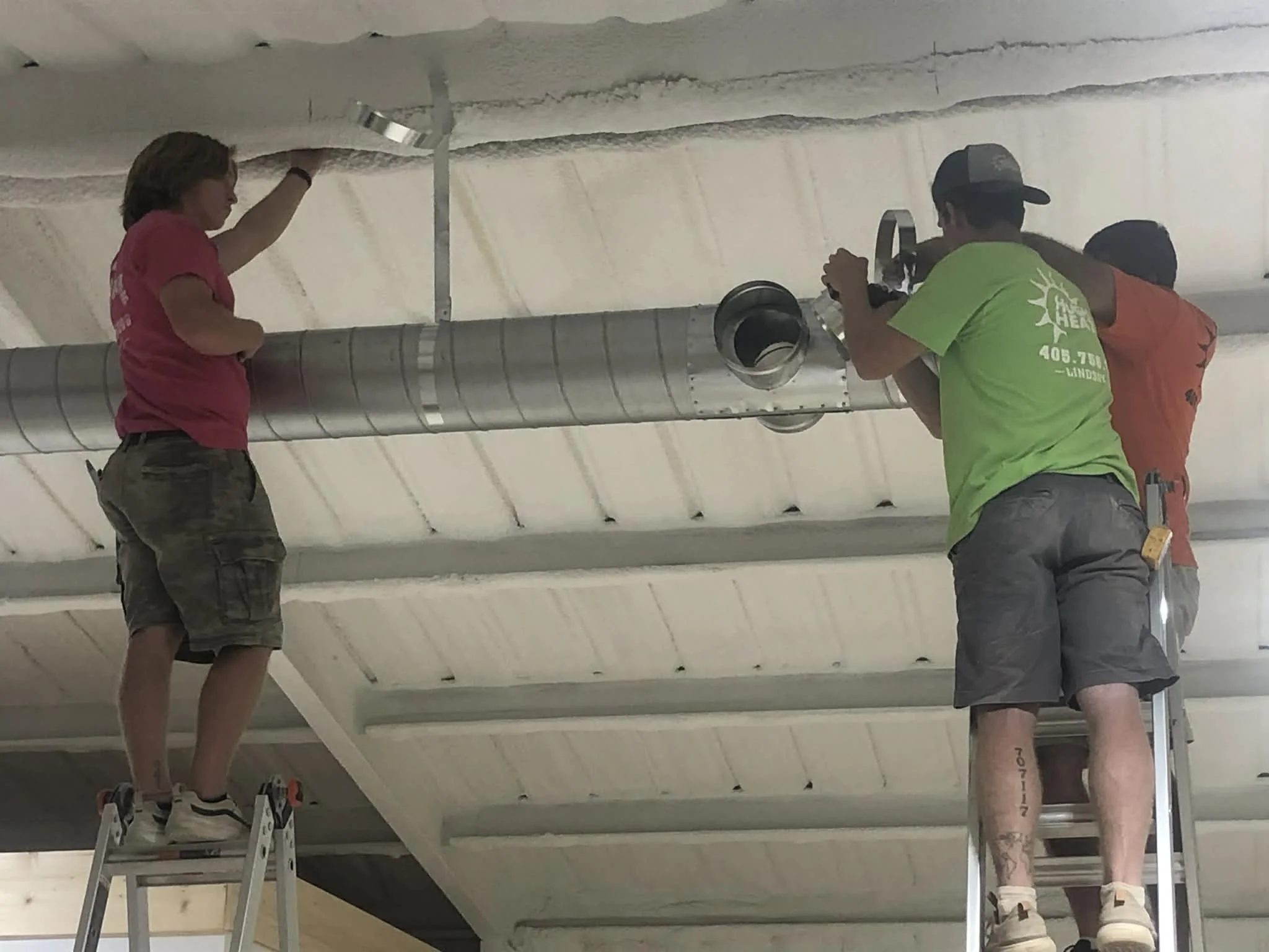 Heat and air technicians working on a commercial installation