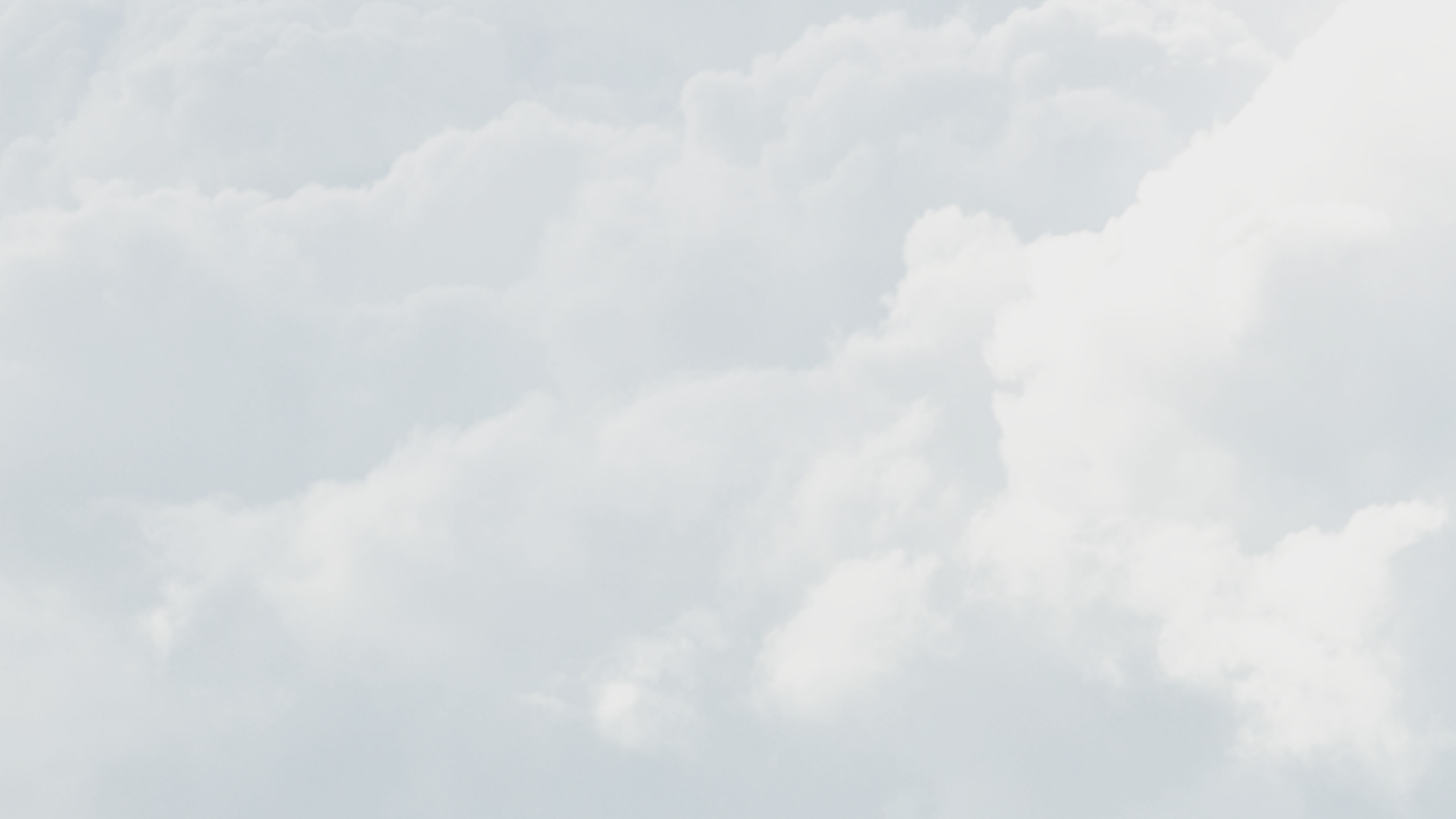 Cloudy sky with light, fluffy clouds.