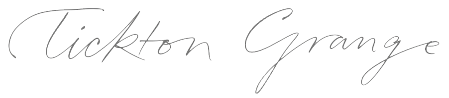 The image contains the logo of Tickton Grange with text 'Tickton Grange' written in cursive font.