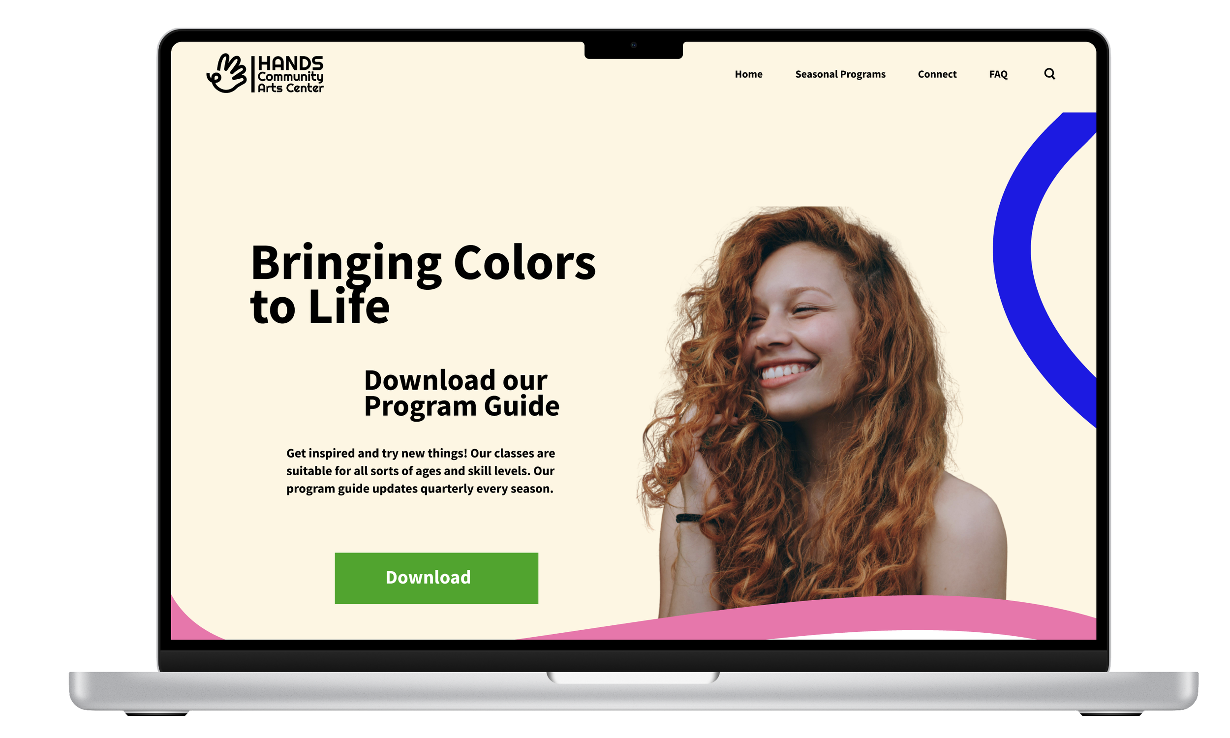 Laptop displaying the home screen of a website for a community arts center named HANDS