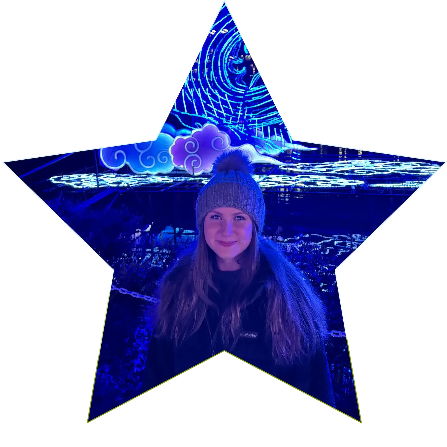 Picture in the shape of a star with a girl named Kelsey standing infront of a dragon made of lights at night wearing a beanie and smiling