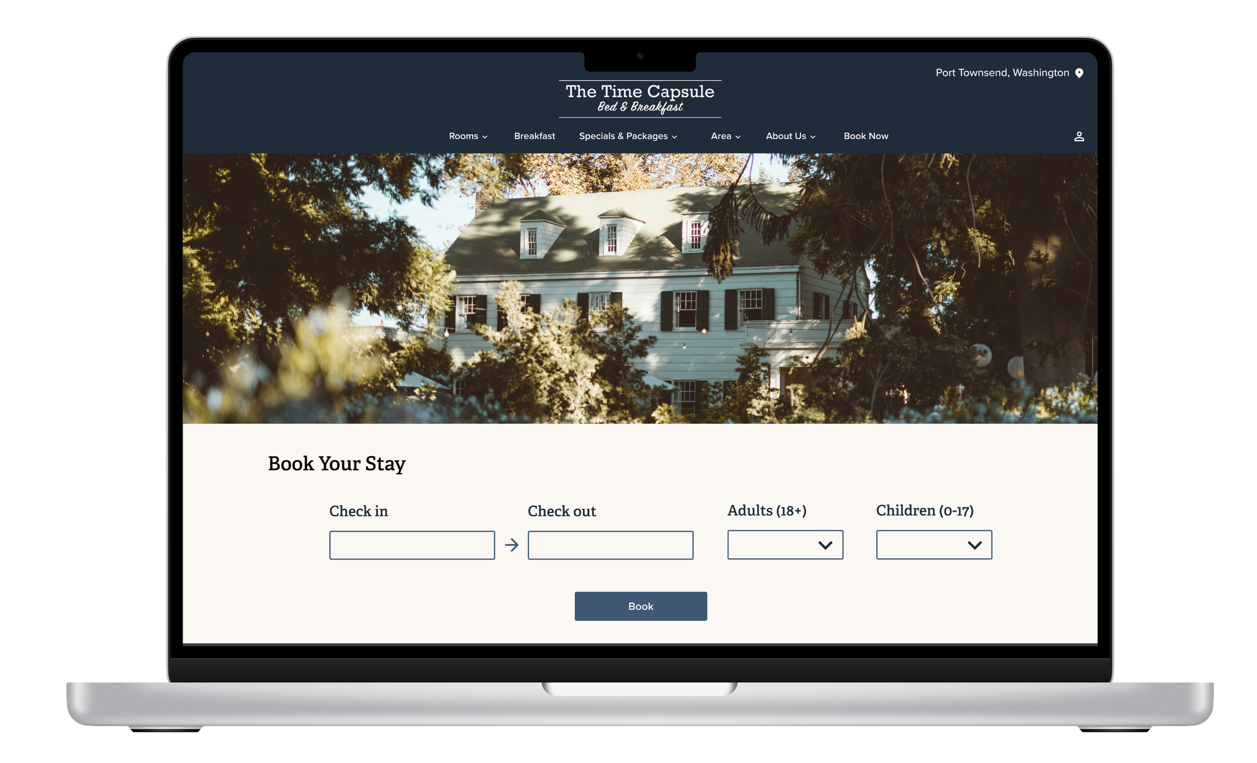 Laptop showing the home page of a bed and breakfast website called The Time Capsule