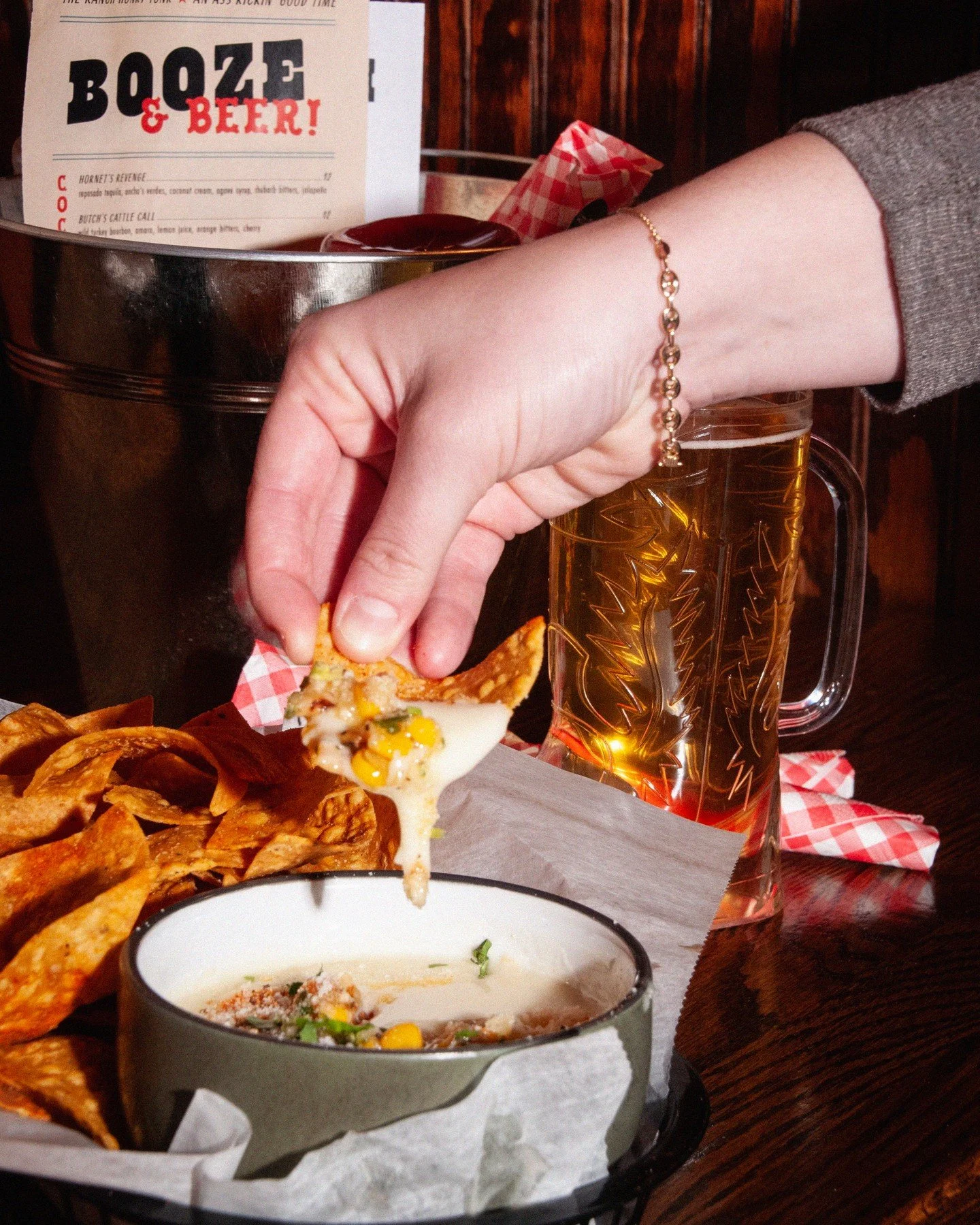 Somewhere between chips and "we should probably order another one." 

Creamy hatch green chile queso. Roasted corn salsa. Cotija cheese. Served with El Milagro tortilla chips.

#TheRanchA2 #HonkyTonkEats #QuesoTime #AnnArborFood #StayLate