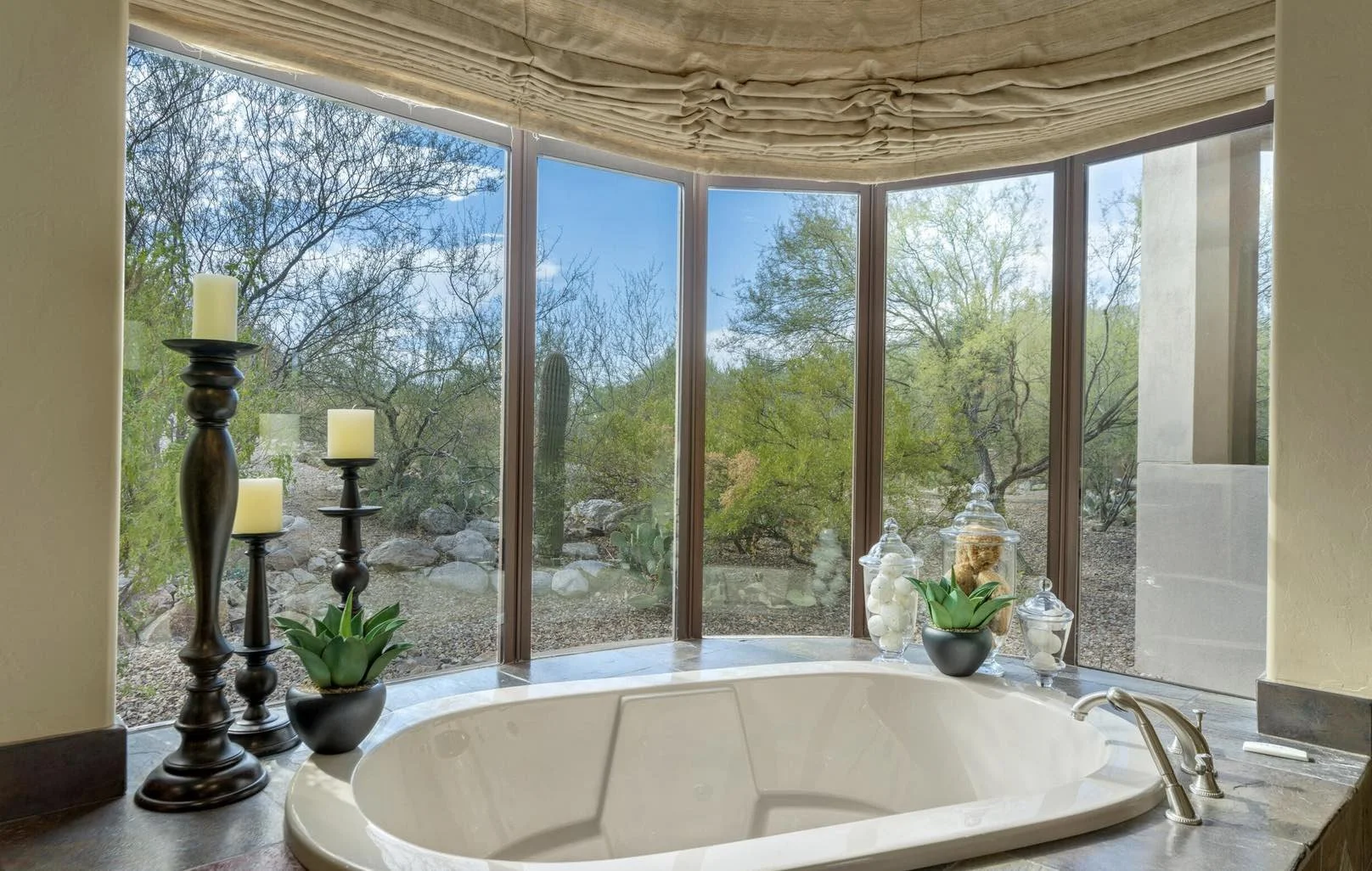 luxury-primary-bathroom-with-bathtub-beautiful-view