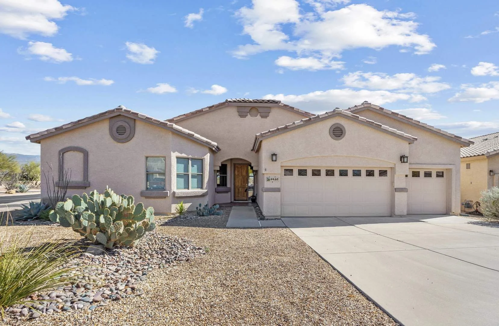 sabino canyon residential property with three car garage single story stucco