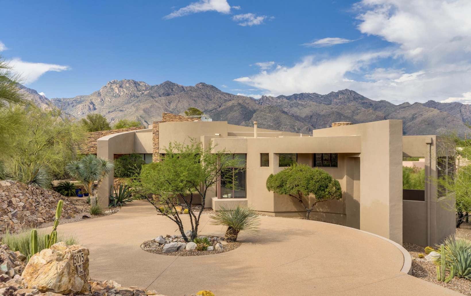 luxury-view-of-front-of-home-with-circle-driveway