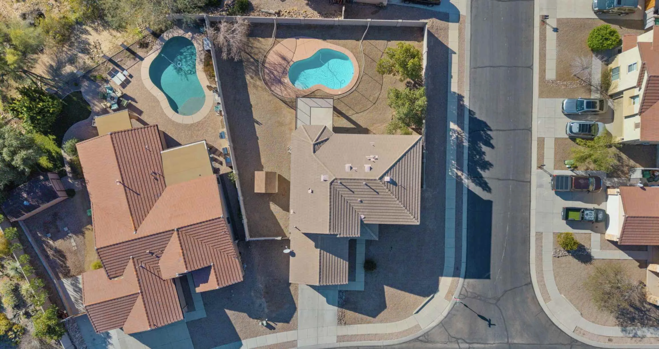birds-eye-view-of-corner-lot-residential-property-with-swimming-pool