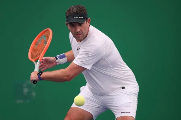 Neil Balmforth from UK hitting a backhand.