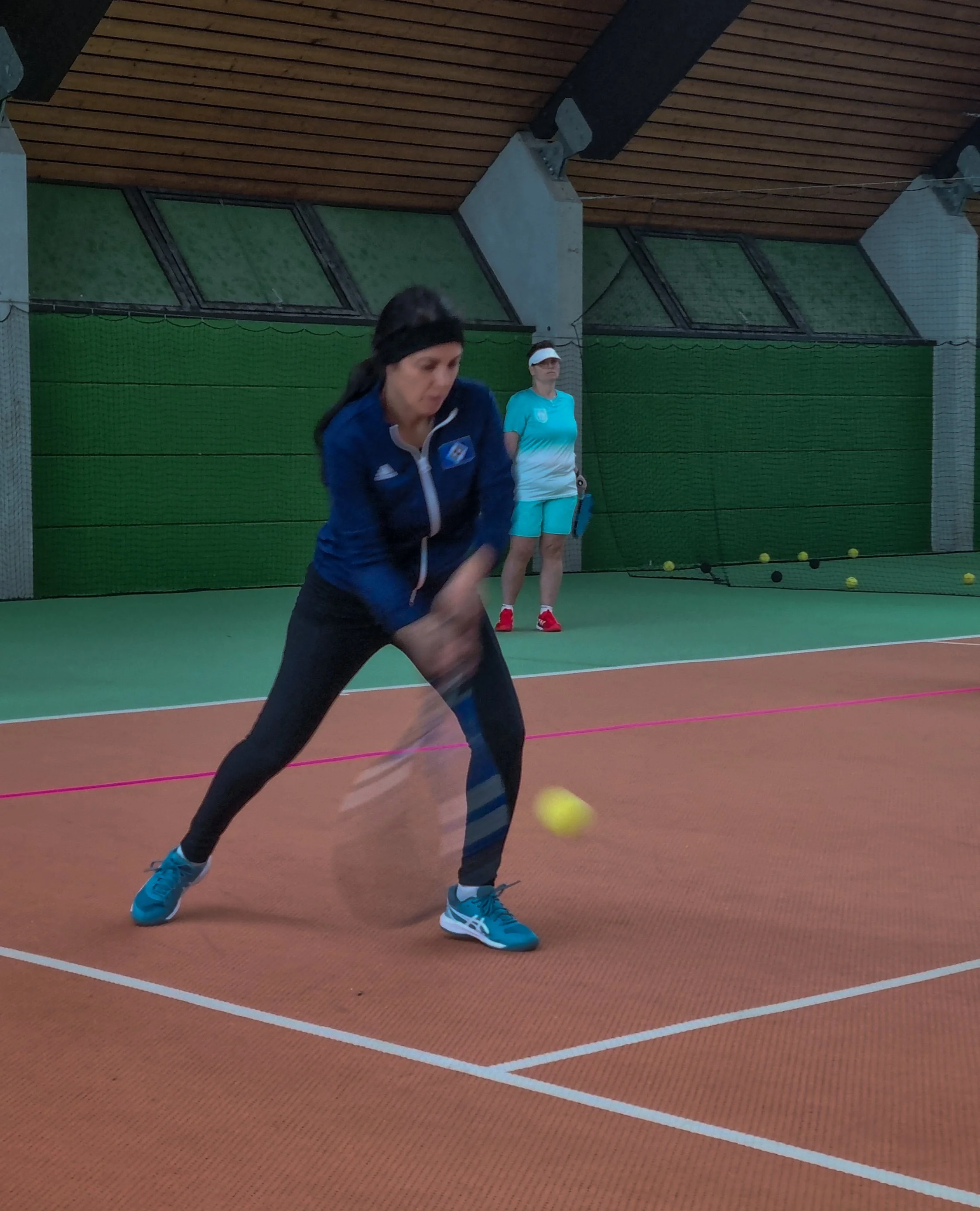 Player hitting a backhand.