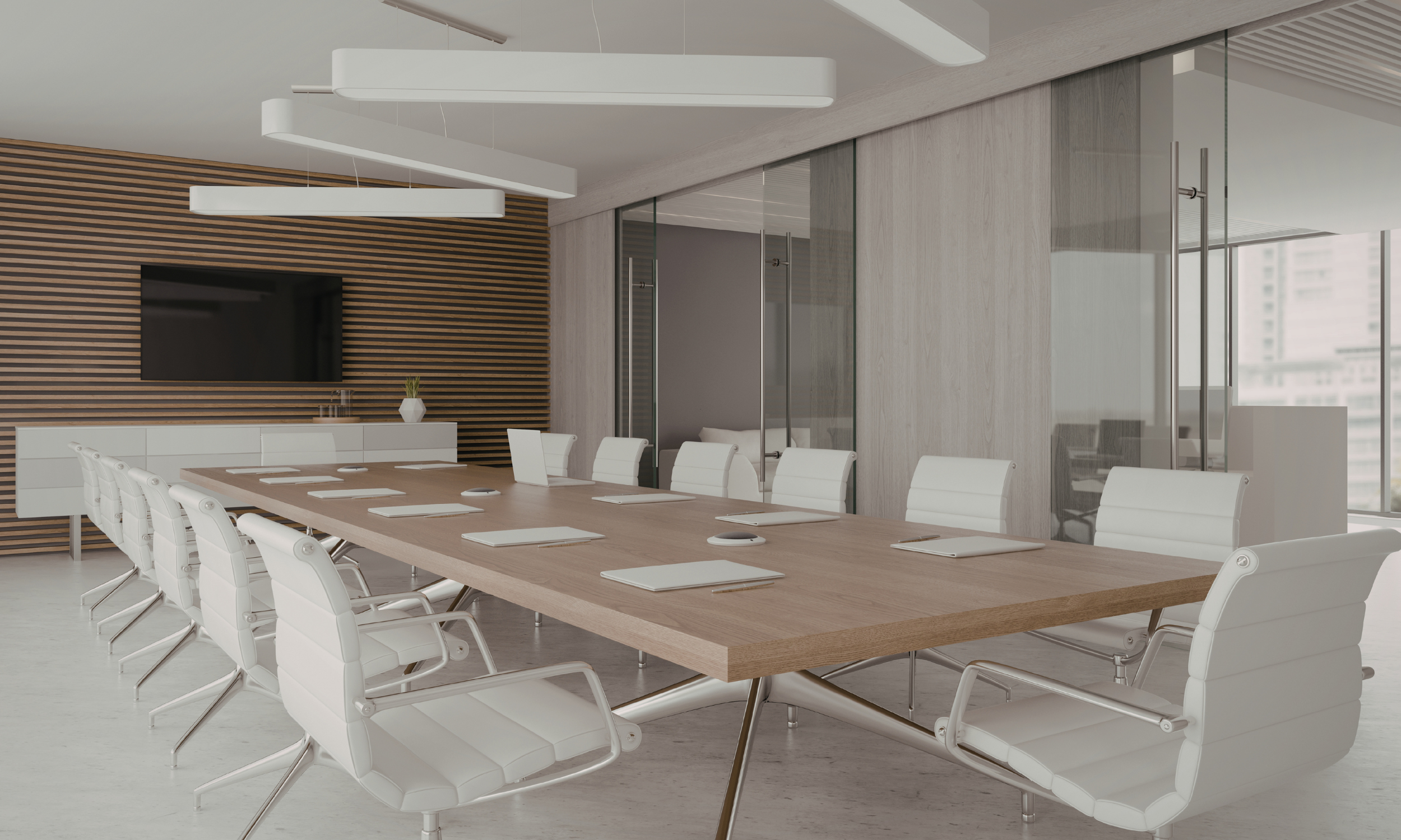 Modern conference room with a large wooden table, white office chairs, a flat-screen TV on the wall, and decorative wood paneling, surrounded by glass walls and large windows.