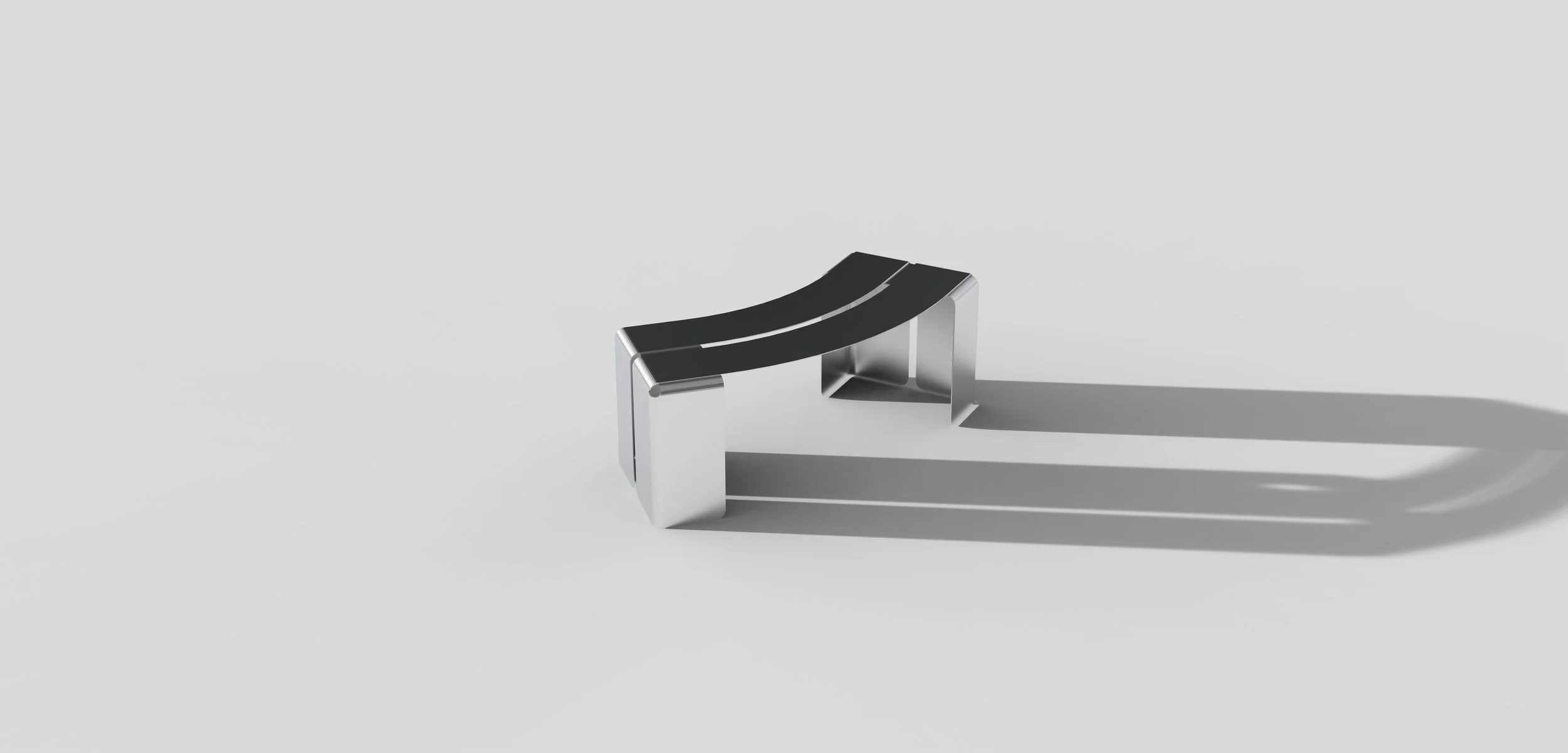 A modern, curved bench with black seating and silver metallic supports, casting a shadow on a plain white surface.