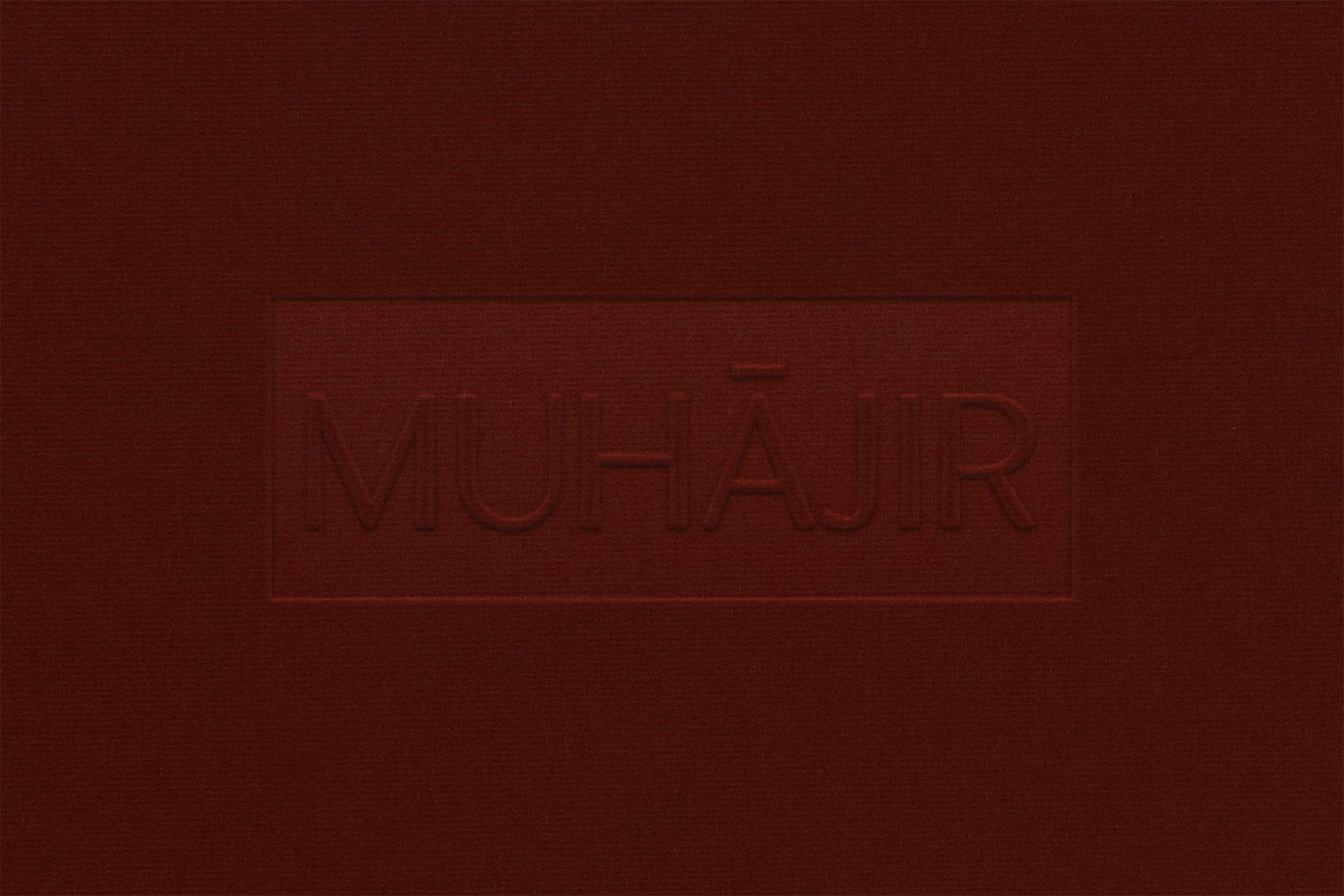 dark red fabric texture with embossed MUHĀJIR