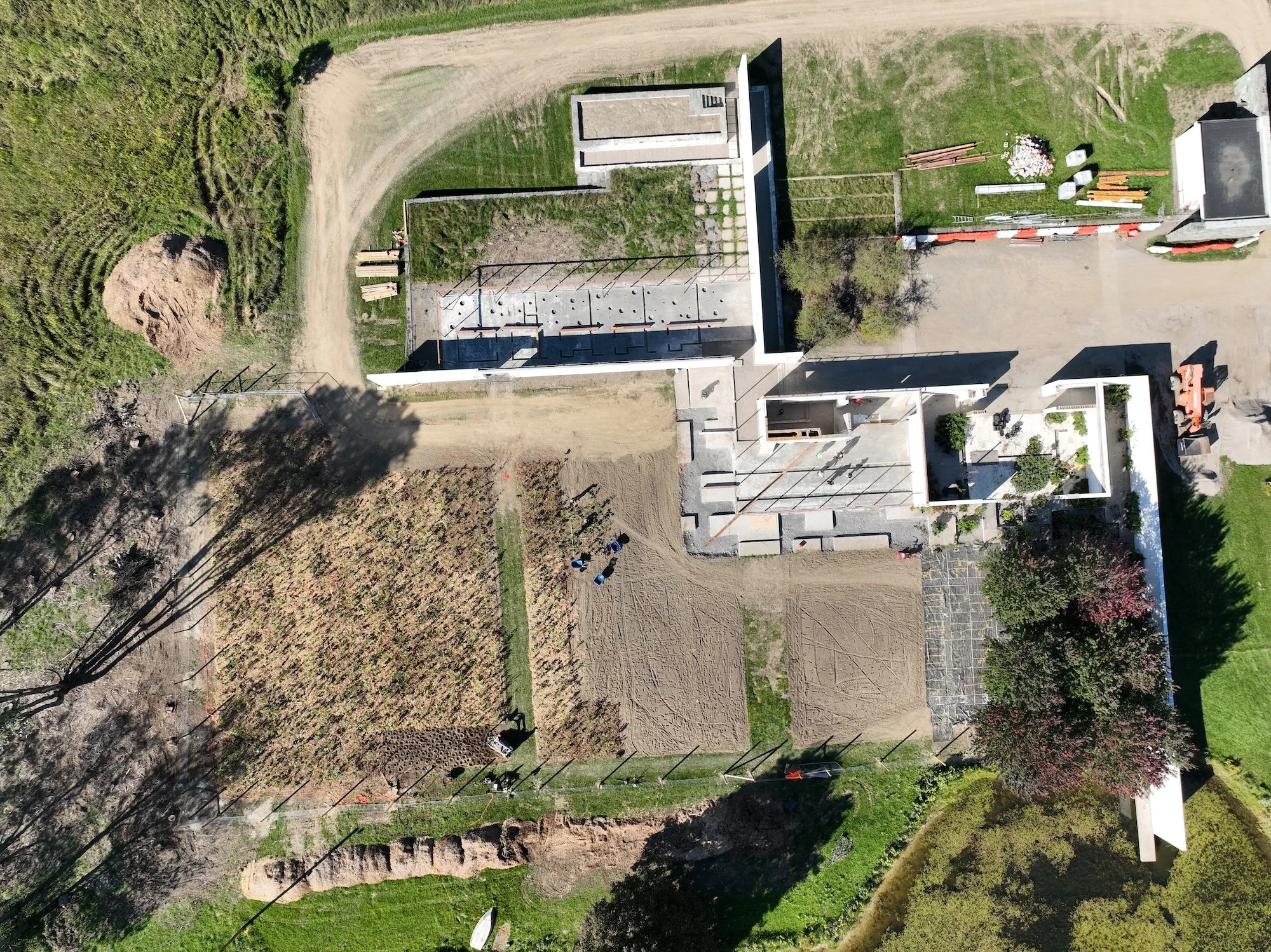 Aerial view of Fairlawn during deconstruction, showing retained walls and surrounding landscape.