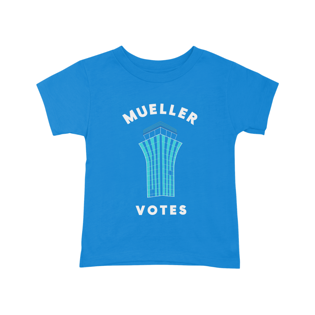 Blue T-shirt with a graphic of a tall building and the words "Mueller Votes" in white.
