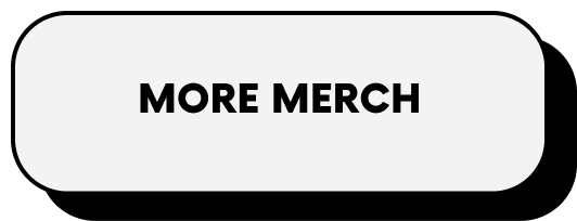 A white sign with black text reading 'MORE MERCH' in capital letters.
