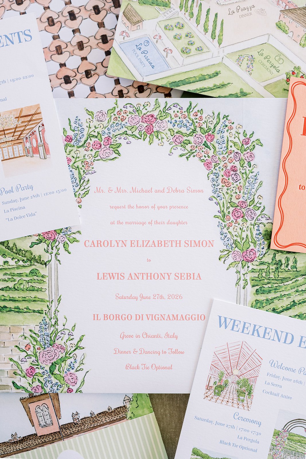 Tuscany wedding invitation suite with orange and green designs and a hand-painted watercolor floral arch
