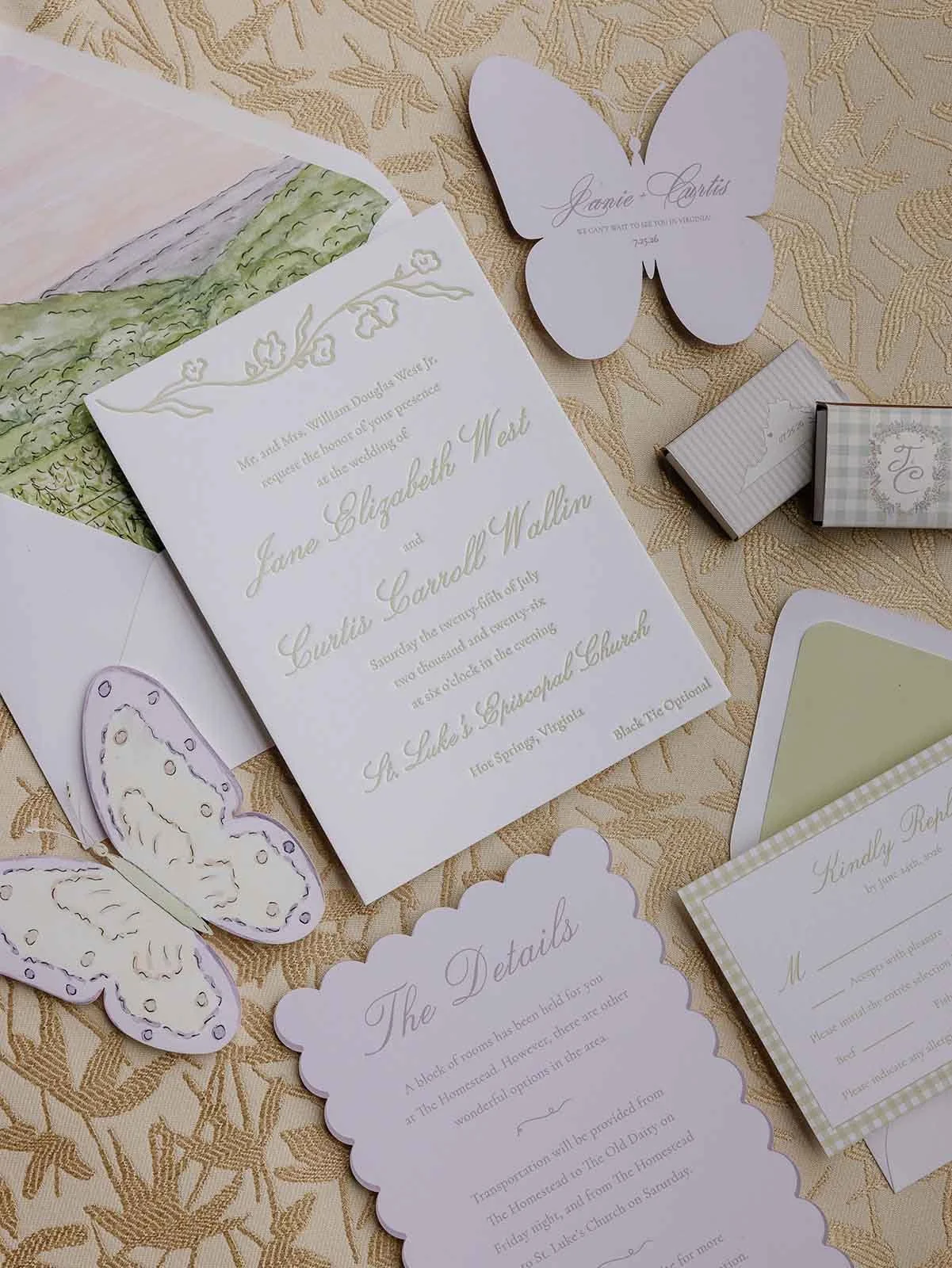 Gold pattern background with various wedding invitation suites on top featuring butterfly cut-outs, invitations, detail cards, and more