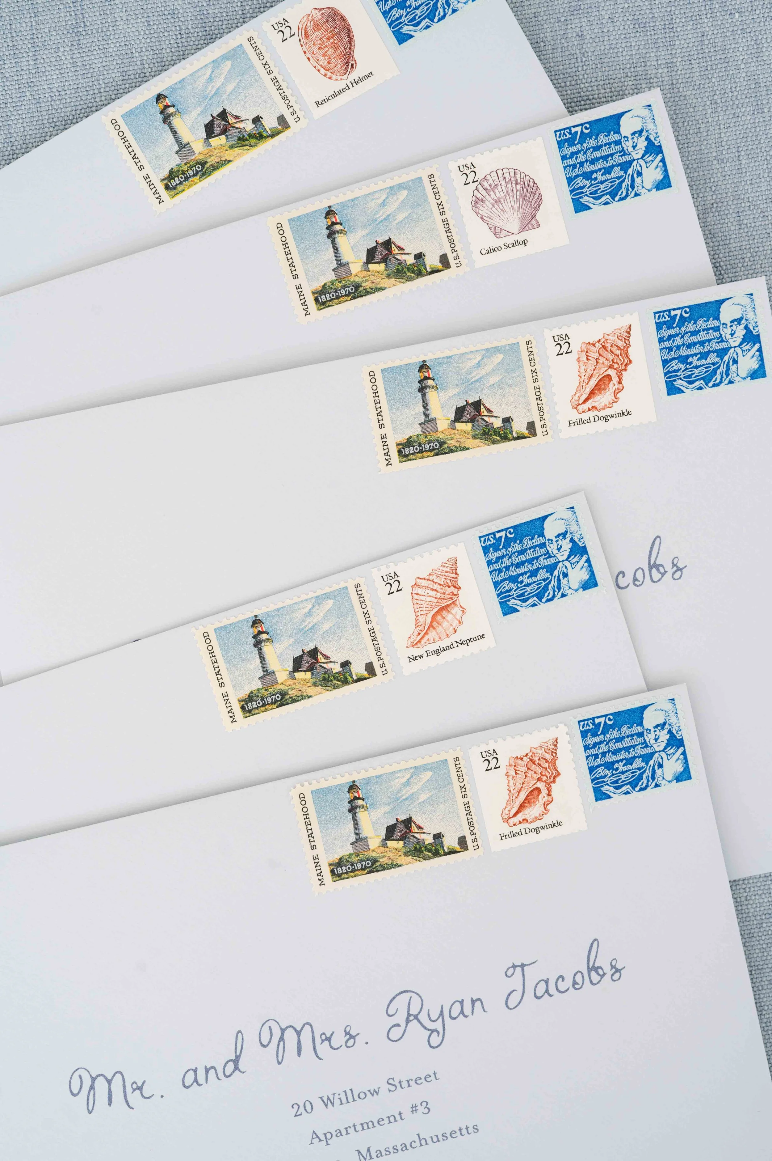Envelope with decorative stamps addressed to a guest for a wedding invitation suite.