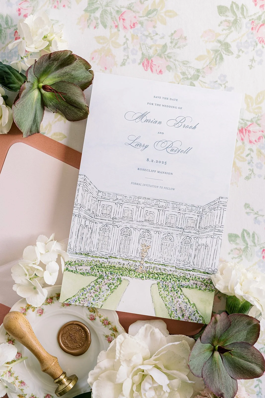 Romantic and pink wedding stationery created by a watercolor artist featuring real florals, a wax seal and a hand-drawn illustration of a wedding venue on the wedding invitation
