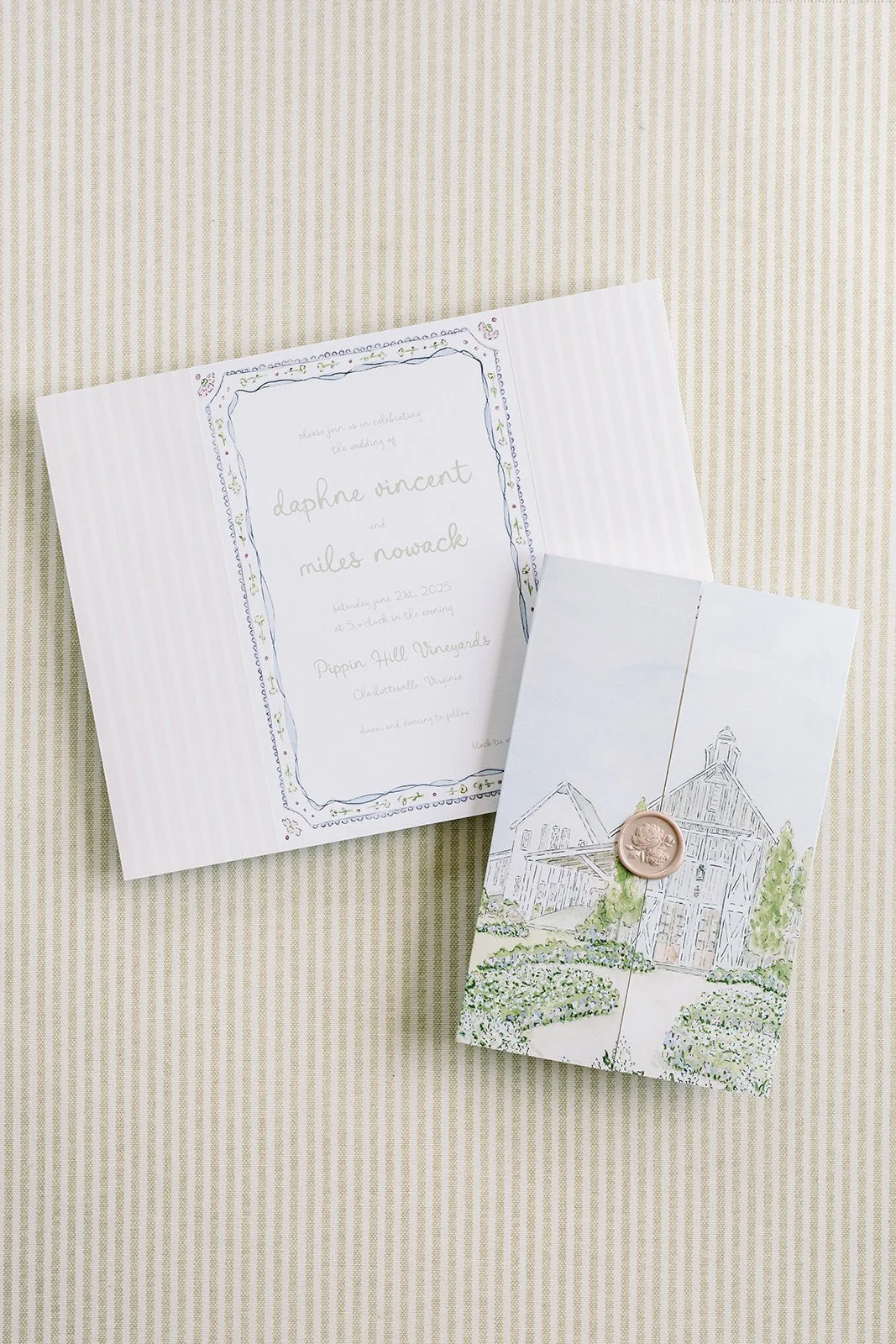 Floral wedding invitation suite created by a watercolor artist featuring a tri-fold painting of the wedding venue and invitation