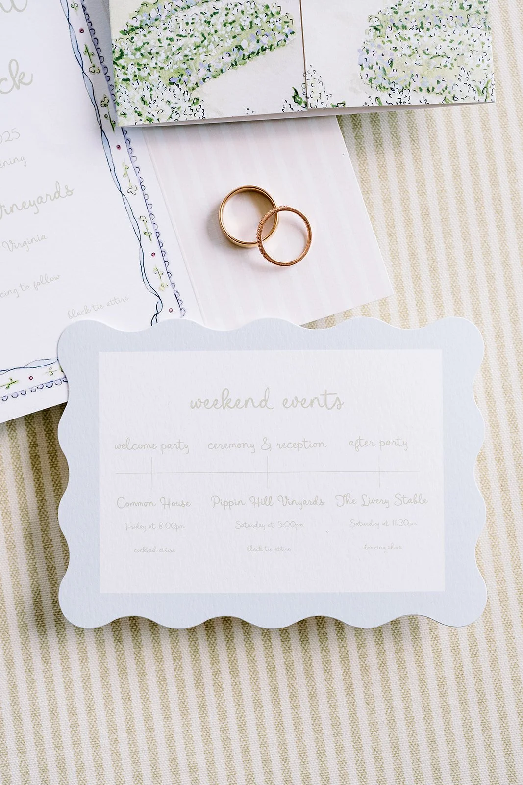 Weekend events card with floral wedding details on a striped background
