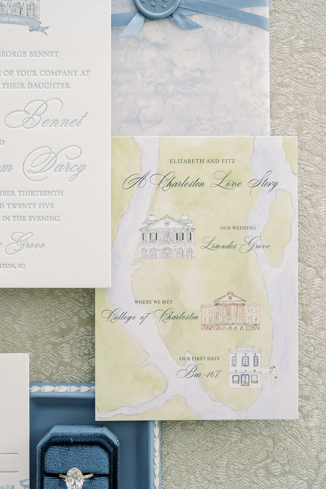 Custom love story map featuring the coast made from watercolor painting with wedding stationery surrounding it