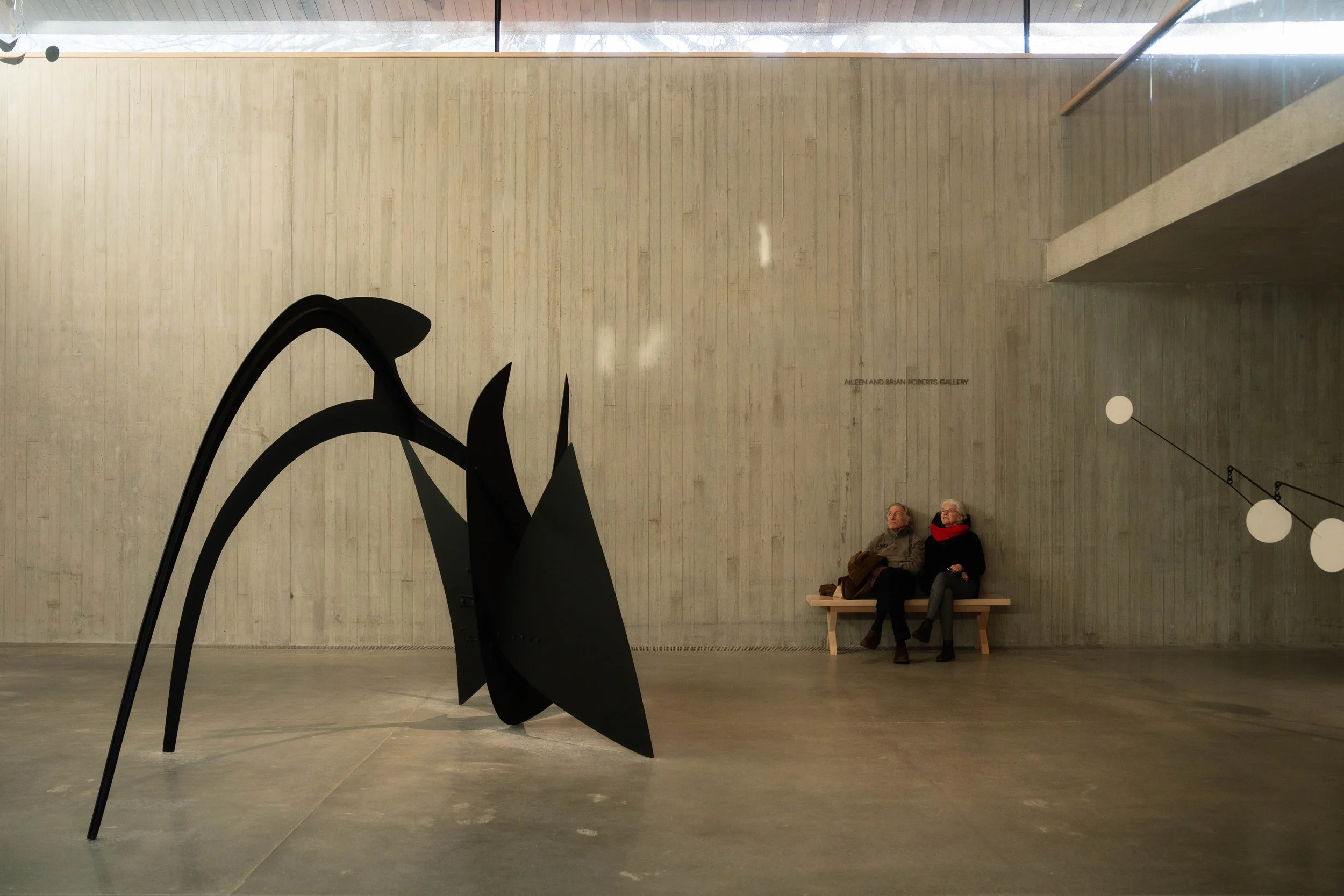 Calder Gardens (Building designed by @herzogdemeuron, Garden designed by @pietoudolf). An attentive old couple contemplating the Black Widow, 1959 designed by American Sculptor by Alexander Calder. Museum, cultural space/interior photography.