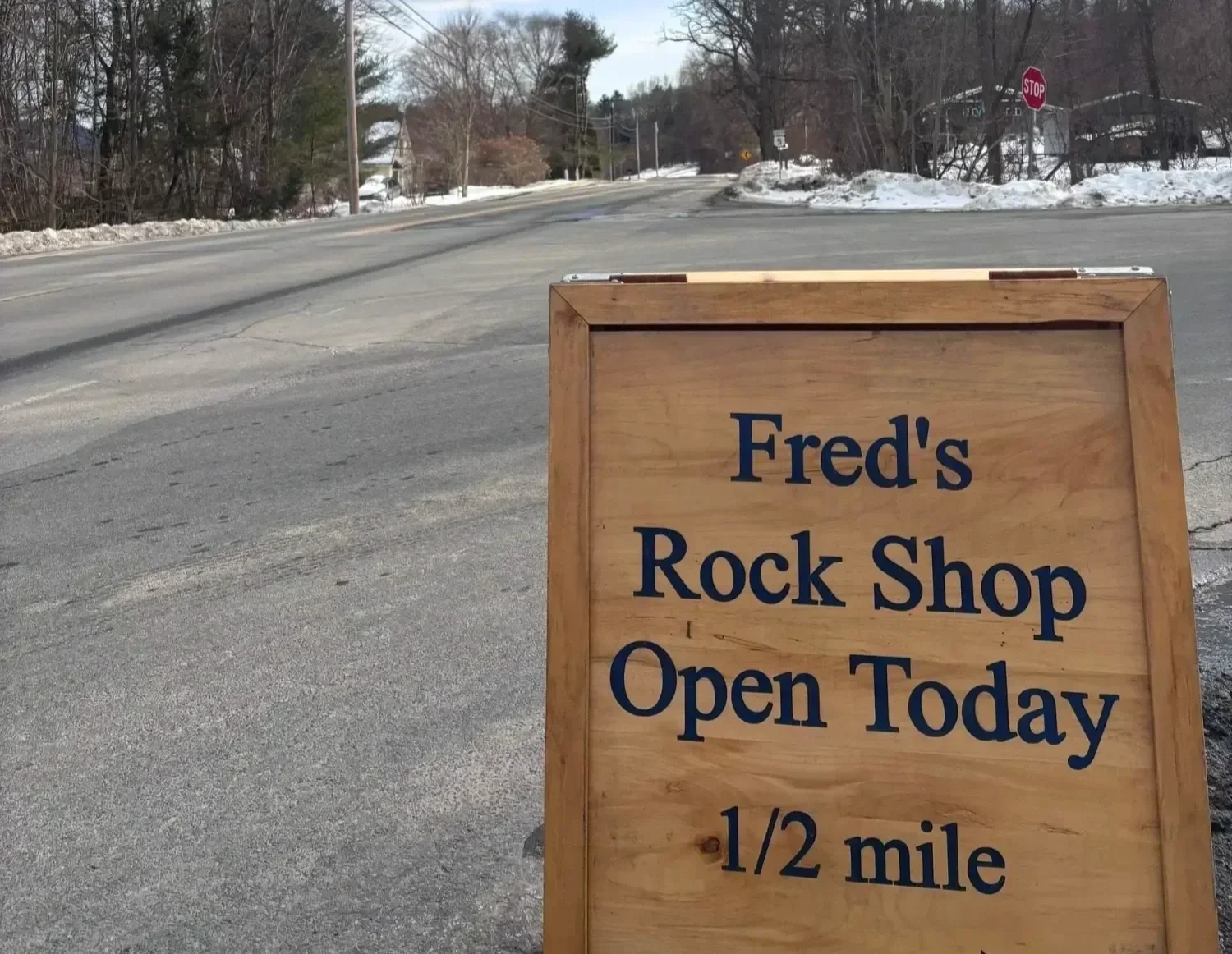 shop-exterior-open-today-sandwich-board-sign-freds-rock-shop-putney-vt.webp