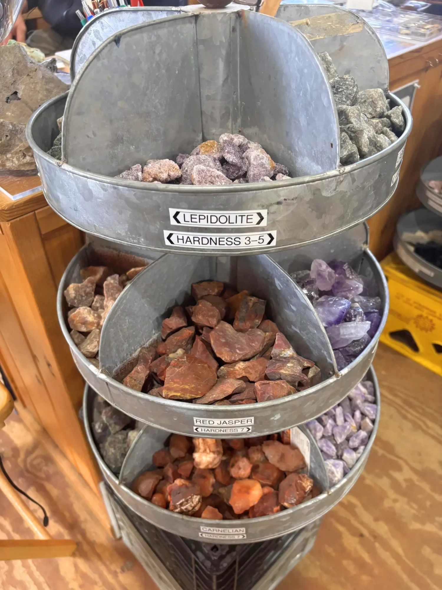 display-rough-lepidolite-red-jasper-carnelian-tiered-bucket-display-freds-rock-shop-putney-vt.webp