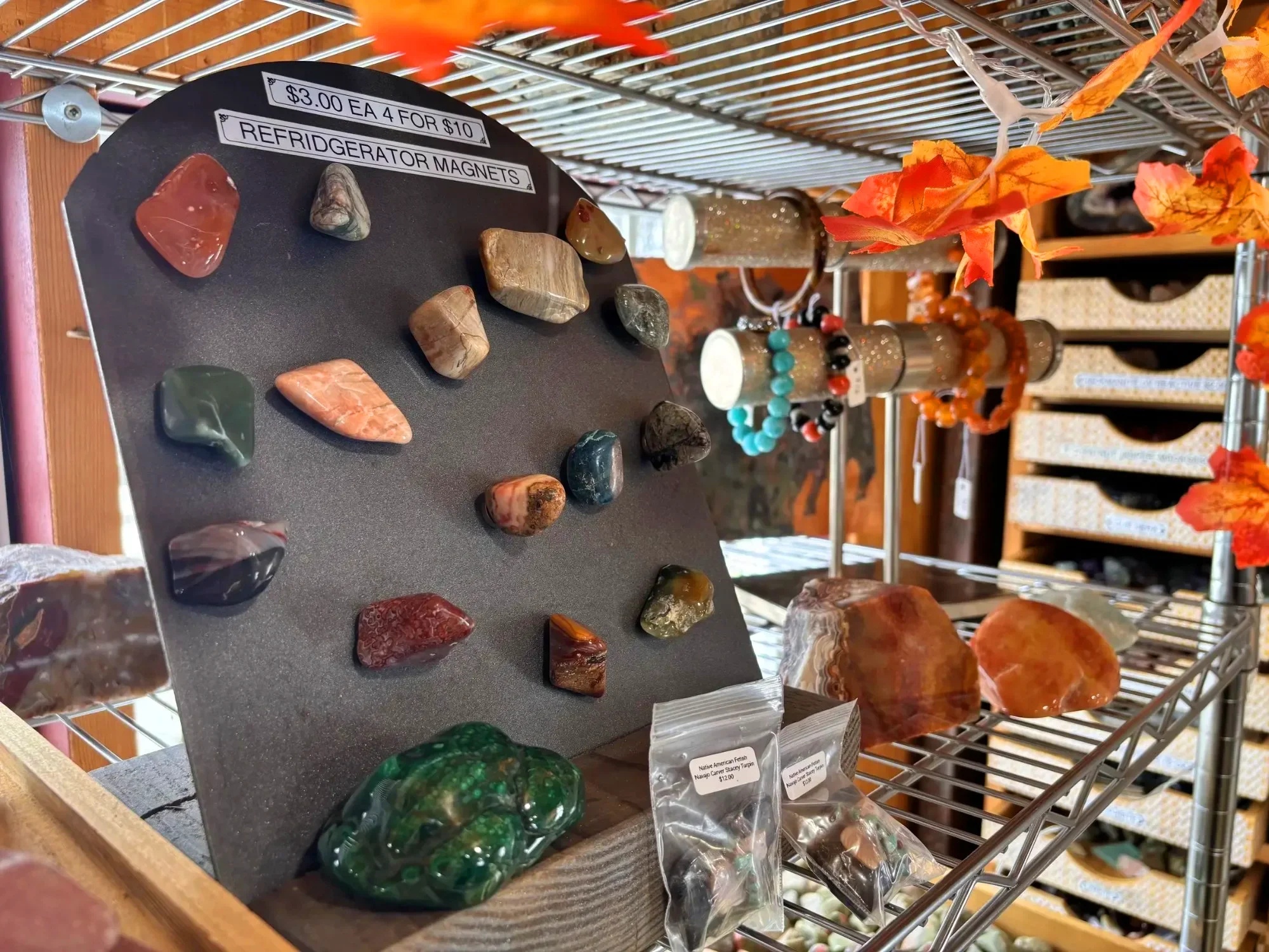 display-jewelry-gemstone-refrigerator-magnets-board-freds-rock-shop-putney-vt.webp