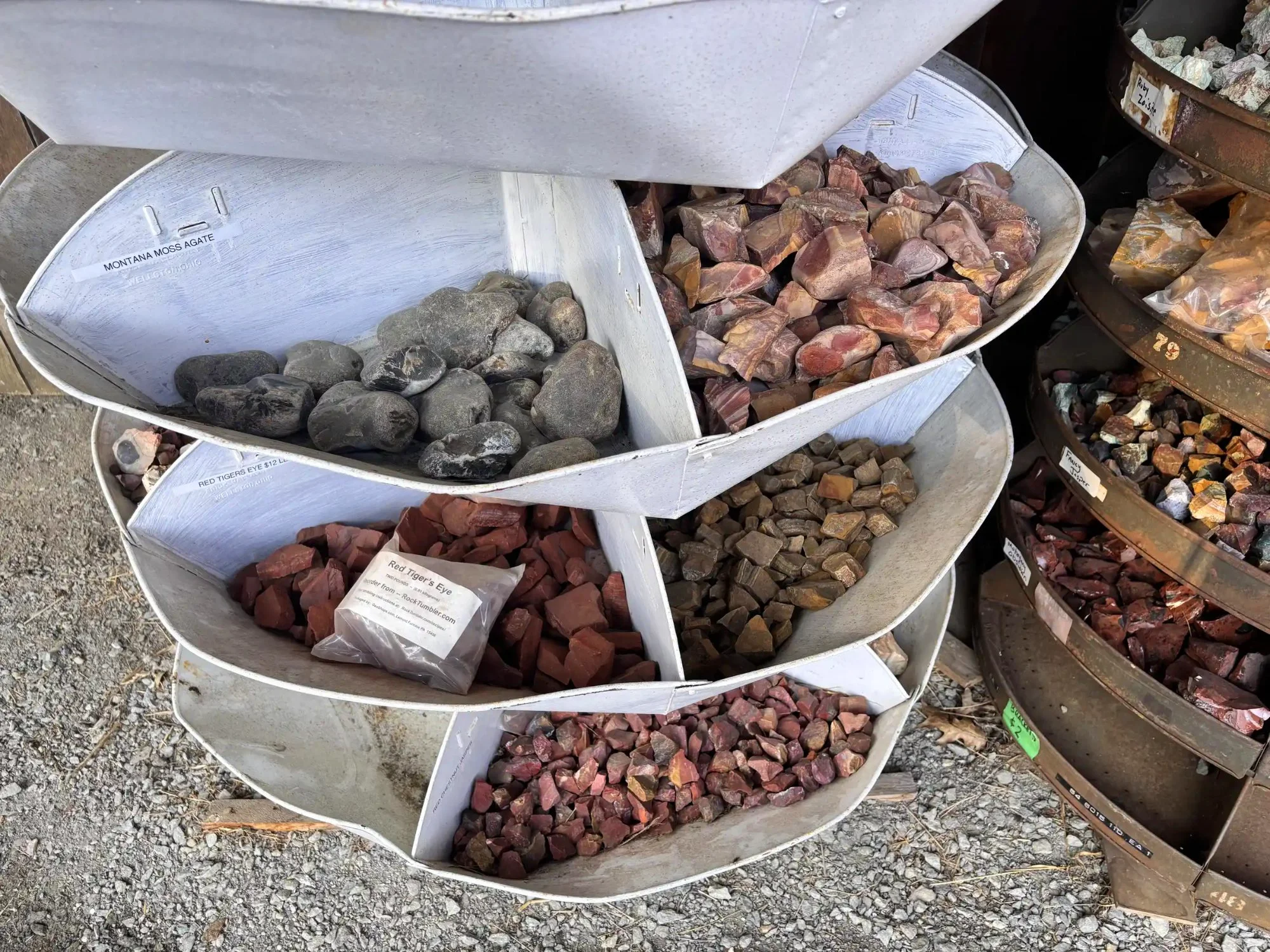 shop-exterior-outdoor-white-tiered-bucket-red-tigers-eye-jasper-freds-rock-shop-putney-vt.webp