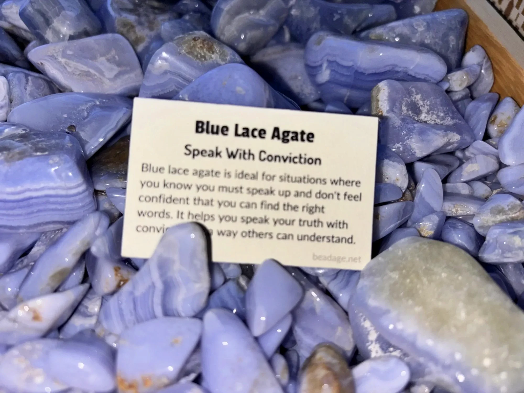 agate-blue-lace-tumbled-stones-speak-conviction-close-up-freds-rock-shop-putney-vt.webp