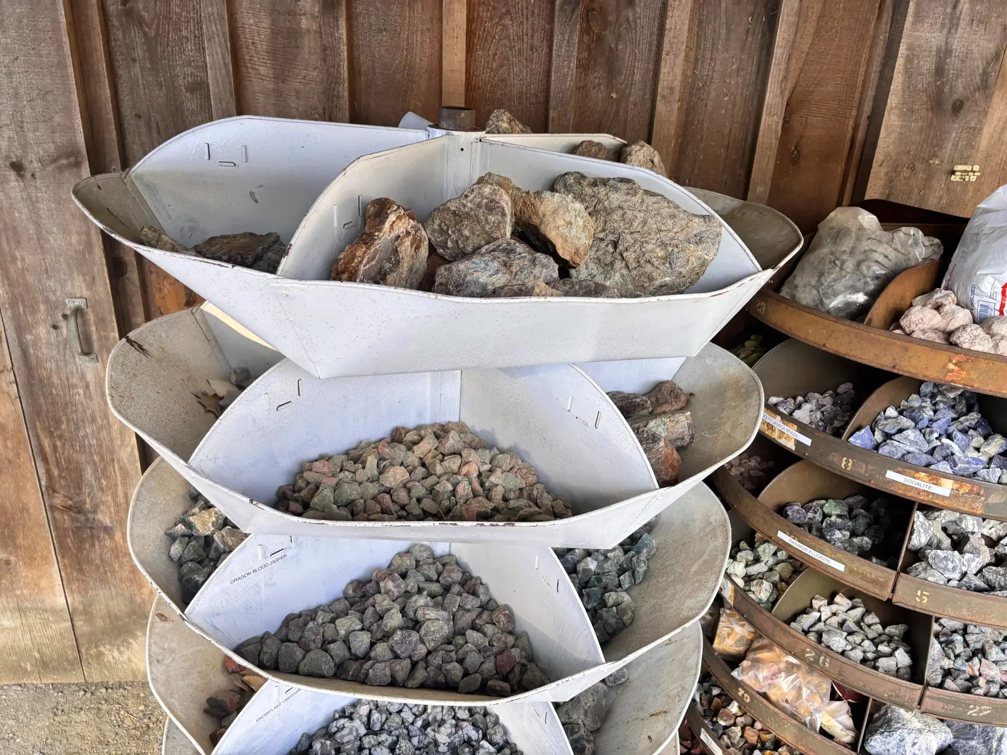 shop-exterior-outdoor-white-tiered-rack-dragon-blood-jasper-rough-specimens-freds-rock-shop-putney-vt.webp