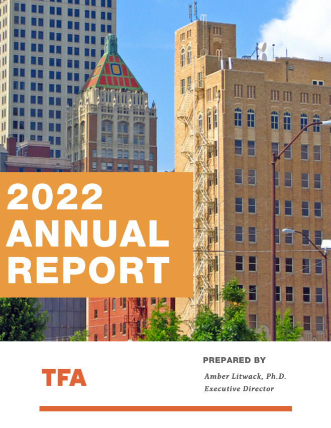 Cover page of 2022 annual report with a cityscape featuring tall buildings and a blue sky.