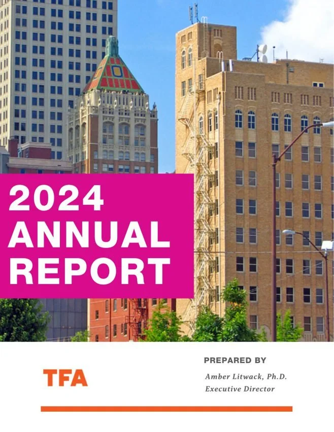 Cover of the 2024 Annual Report featuring a cityscape with historic and modern buildings, including a distinctive building with a colorful, tiled, pyramid-shaped roof.