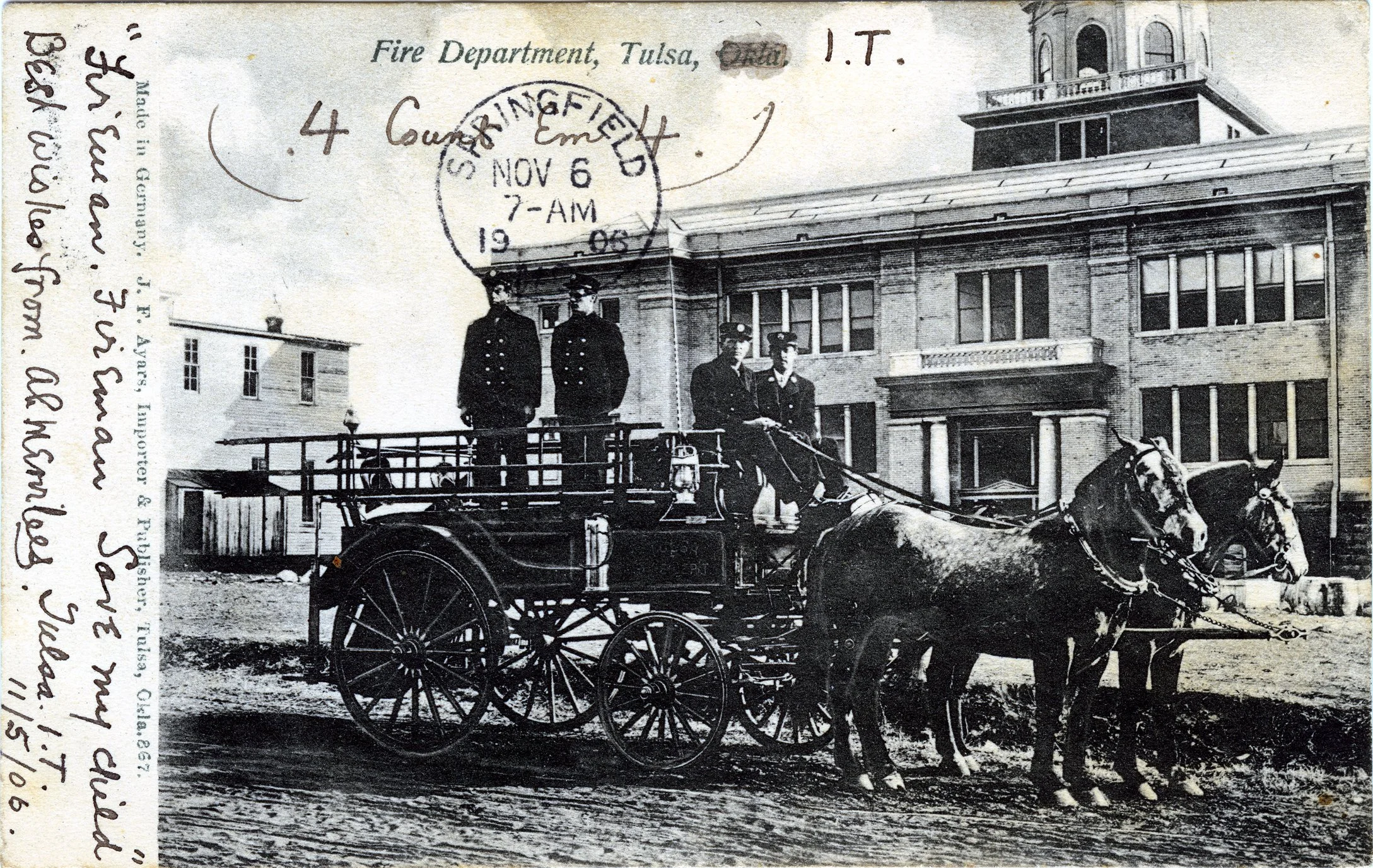 Historical black and white photograph of firemen on a horse-drawn fire truck in front of a large building, with a circular postmark stamp dated November 6, 1905, and handwritten notes along the left side.